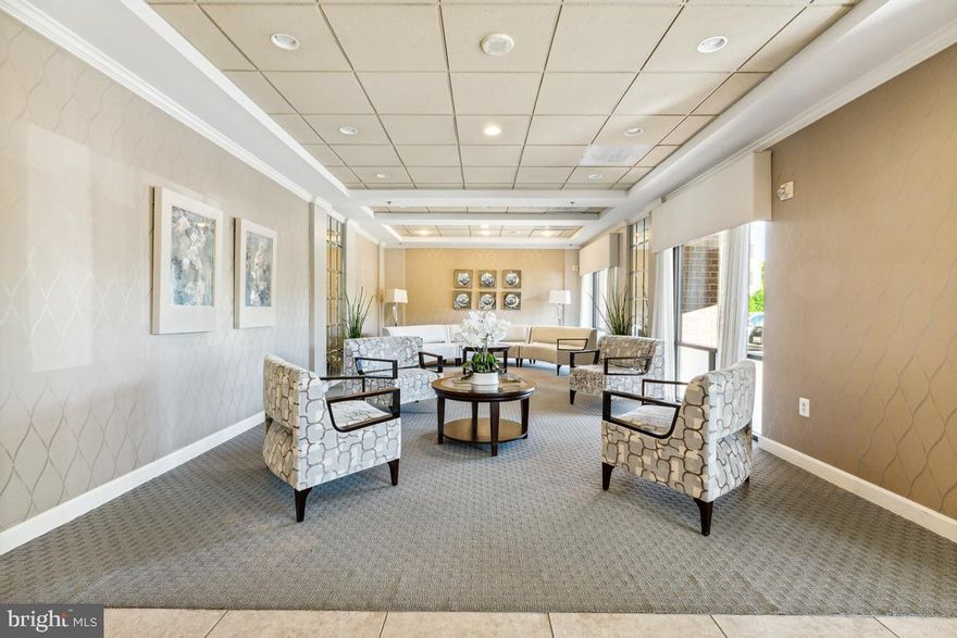 BEAUTIFUL LIGHT FILLED 2 BEDROOM, 2 BATH CONDO IN A 55+ ACTIVE SENIOR GATED COMMUNITY WITH GARAGE PARKING (accessible through lobby door) WHICH IS VERY CLOSE TO THE BUILDING ENTRANCE! 
This wonderful condo is located in the sought after Vantage Point East and has an Open Floor Plan with 9 ft ceilings, fireplace and the entire unit is freshly painted with new carpeting throughout. There is a large kitchen with an abundance of cabinet and kitchen counter space, a large owner's suite with a huge walk-in closet with an additional mirrored closet and an en suite bathroom with a bathtub and separate shower.  An additional full guest bathroom is offered as well as a second large bedroom with access to the wonderful four season tiled sunroom.  This is a great area to use for relaxing and having morning coffee.  The separate laundry room has wonderful space with open shelving and a dedicated separate storage unit conveys. (Storage #142).  Vantage Point East has a stunning newly decorated lobby with plenty of elevator access.
Enjoy all of the many amenities that Leisure World has to offer...golfing, tennis, pickleball, indoor and outdoor pools, community centers with gym, art classes, woodworking, gardening, walking paths and onsite medical facilities.  You are minutes from the Shopping  Center which has everything you could possibly need from Giant Food Store, Restaurants, Banks, Post Office and Much More.
Did we mention that garage space which you access through the lobby versus going down to the basement level and is very close to the elevator and the entry door into the building?
Welcome Home!