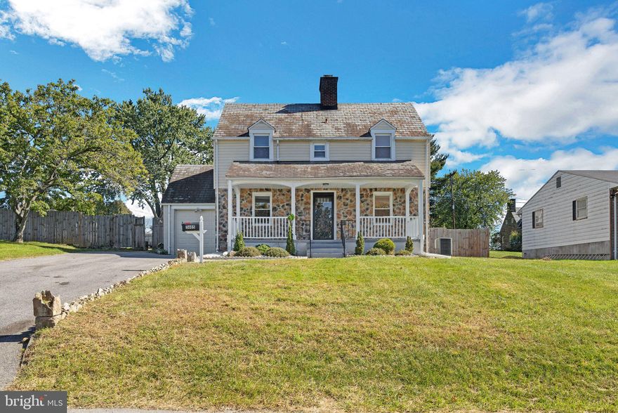 This delightful three-level colonial home combines classic charm with modern updates. Boasting 3 spacious bedrooms, 2 full bathrooms, and a half bathroom, it offers both functionality and style. The exterior features a decorative stone facade and a welcoming front porch, ideal for enjoying quiet mornings or evenings outdoors. A paved driveway leads to the attached one-car garage. On the main level, you'll find a bright living room with gleaming hardwood floors, large windows that fill the space with natural light, and a decorative fireplace that adds character to the space. The updated kitchen features sleek black cabinetry, granite countertops, and stainless steel appliances, including a gas range and microwave, all set against a stylish backsplash. A convenient half bath on this level adds practicality. Upstairs, the home offers three spacious bedrooms, all featuring hardwood floors, and two full bathrooms. The primary bathroom includes a beautifully tiled shower for a spa-like touch. Each bedroom is filled with natural light and ample closet space, ensuring comfort for the entire household The finished basement provides additional living space, perfect for a recreation room, home office, or gym, with carpeted floors and recessed lighting. This home is equipped with a gas furnace and gas water heater, ensuring efficient heating and hot water year-round. Outside, the fenced backyard offers privacy and space for outdoor activities or gardening. This well-maintained colonial home can be yours. Contact us today!