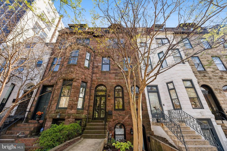 Welcome to 2008 R Street NW, a distinguished brownstone in the heart of Kalorama—one of Washington, DC’s most prestigious and picturesque neighborhoods. Originally commissioned in 1886 by Benjamin H. Warder, the agricultural magnate whose company later became part of International Harvester, this stately 5-bedroom, 4.5-bathroom residence blends the grandeur of a bygone era with tasteful contemporary updates. 

The classic stone façade and wide entry steps usher you into a world of architectural refinement. Inside, soaring 11-foot ceilings, original millwork, heart of pine floors, and preserved details like antique doorknobs and radiator grates reflect the home’s rich history. A gracious formal entry gives way to expansive entertaining spaces on both the main and upper levels, including a large first-floor reception room/office with handsome fireplace, mirrors and even larger second-floor living room with handsome built-ins, its own fireplace, recessed lighting, and wonderful flow to the kitchen, dining room, and private deck beyond. A first-floor bedroom suite enjoys elevator access and its own private covered deck.  

The kitchen, warm and functional with south facing windows, offers plentiful storage, a sunny breakfast room, LG appliances, the same character-rich pine floors underfoot, and a convenient powder room. Upstairs, the owner’s suite is a retreat of modern indulgence: a fully renovated marble wet room with dual rain showers and a double vanity adds a spa-like sensibility. Additional bathrooms have also been updated, while the lower level features a fully renovated and separately metered one-bedroom unit with a Certificate of Occupancy, perfect for rental income or extended-stay guests. 

The top floor offers a bonus studio or bedroom space with excellent light and elevated views—ideal for creative pursuits or a hidden home office. Thoughtfully updated for modern living, the home features a rare private elevator with access from the parking spaces and stops on each of the 3 main living levels.   Keep the location and ditch the steps!  The HVAC was newly serviced and fastidious maintenance performed on all systems, plus there is a new hot water heater. Two-car/three-car parking and generous walk-in attic storage add function and daily convenience.  

Set just off Connecticut Avenue and moments from the metro, Dupont Circle, Mitchell Park, Rock Creek trails, P Street Beach, and a vibrant mix of restaurants, cafes, and shops, this location offers quintessential DC walkability and charm. Nestled among tree-lined streets and embassies, the home provides an ideal urban sanctuary. 

Steeped in history yet wholly livable for today, 2008 R Street NW is a unique offering in a neighborhood that epitomizes the very best of Washington, DC. For those seeking storied architecture, thoughtful upgrades, and an unbeatable location, this is the one.