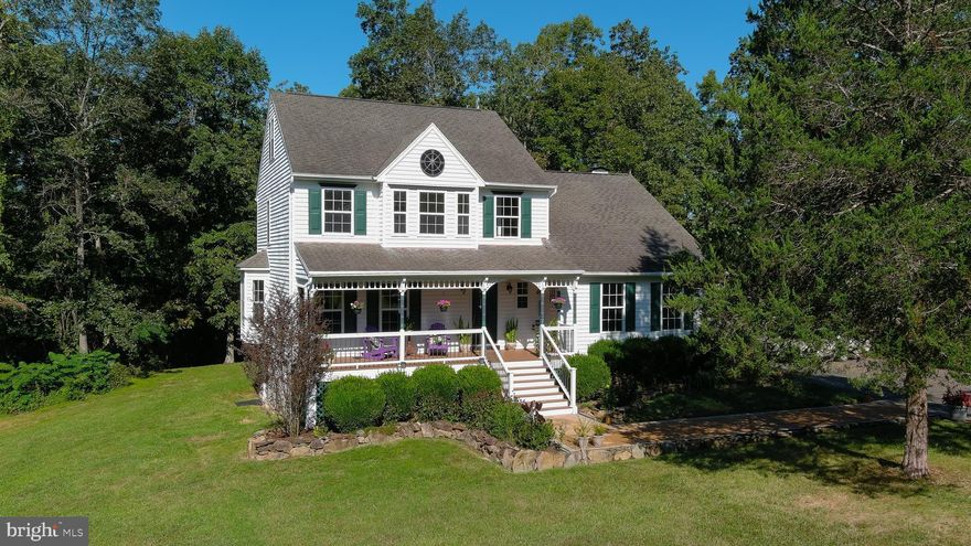 SO PEACEFUL, SO ENCHANTING, SO CONVENIENT!   Quick access to scenic Route 211 and Route 229.  This beautiful home with character and welcoming porch sets it apart from the cookie cutter style.  Mostly open 3 acres with a variety of established flower gardens with perennial and indigenous plants.  Rocks for borders are from the property..  A lovingly  cared for home by the original owners.  First time on the market.   Large light filled open concept kitchen with plenty of counter space and cabinetry with pantry plus space for your favorite hutch!  Plenty of windows to bring in the natural setting.  Family room with vaulted ceilings, Hunter ceiling fan, beams, open to 2nd floor with large double glass doors to walk out to deck.  Fireplace trimmed with lovely mantle and wood burning stove.  First floor also offers a bonus room to make with what you want.   Study, playroom, formal living room, den, extra space for visiting guests or office.  The possibilities!  High speed internet available.  Second floor has Primary with en suite bath, with separate soaking tub and shower and  2 spacious closets.    A full Hall Bath and Bedrooms 2 and 3.   Bedroom 3 has built in drawers and brings in the sunrising light.  Private staircase leads to 3rd floor to 4th Bedroom with skylights and windows.    Outside there is a custom and functional shed with 2 doors  and ramps to give easy access to your supplies.  Shed includes overhang for shade and patio big enough for table and chairs.  Space for outdoor fire pit makes this a perfect outdoor getaway.   Connect with nature on the walking trail  on property.  2nd shed is by deck for gardening tools.  Back yard deck with awning for shade, overlooks flower gardens.  Front yard has a kick wall to exercise and practice soccer drills. and can also be used as a  back drop for outdoor movies.   Ornamental  compass feature on house conveys.   Electric with changeable lighting. 
 Great for festive gatherings and holidays.   Large  attached  2  car garage has work bench .   Underground hidden fence for your pets.  Plenty of room for everyone!   Freshly cleaned carpet, glass replacement on most windows, new carpet in family room, and  professionally painted walls, ceilings, trim and doors throughout with upgraded hardware and lighting  pulls it all together and move in ready.   Plenty to do in this rural setting.  Lovely quaint towns and villages nearby for shopping , restaurants, breweries, wineries  and local festivities.   Amtrak Station at the Town of Culpeper.  Commuter lot and convenience store 1 mile from property.  Old Bridge road is named for the nearby 143 yr old iron bridge which was rehabilitated and is back in service.   Beautiful Shenandoah National Park is near  for hikes and lovely drives yet the property is approximately 60 miles from DC for your city desires.   Welcome Home!