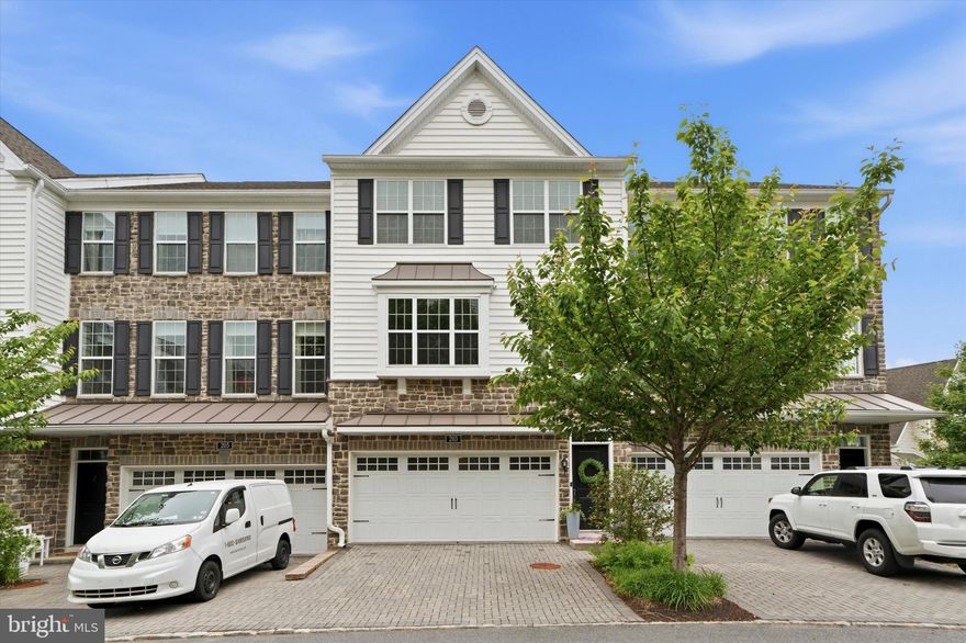 Welcome to 203 Corvus Circle in the sought-after Ravenscliff community of Media! This stunning Toll Brothers carriage-style townhome offers the perfect blend of modern luxury, comfort, and convenience. Built in 2018, this beautifully maintained 3-bedroom, 2.5-bath home features nearly 2,800 square feet of thoughtfully designed living space with an open-concept floor plan ideal for everyday living and entertaining.

The sun-drenched main level showcases gleaming hardwood floors, a spacious living area with a cozy gas fireplace, and a gourmet kitchen complete with stainless steel appliances, oversized island seating, abundant cabinetry, and stylish finishes throughout. Enjoy seamless indoor-outdoor living with two private decks — perfect for grilling, relaxing, or hosting guests.

Upstairs, the expansive primary suite serves as a private retreat with a large walk-in closet and spa-inspired bath featuring dual vanities and an oversized shower. Two additional generously sized bedrooms, a full hall bath, and convenient upper-level laundry complete the bedroom floor.

The lower level offers incredible flexibility with a bonus living space ideal for a home office, gym, media room, or playroom, plus a walk-out basement with soaring ceilings ready for future finishing possibilities. Additional highlights include a 2-car garage, zoned HVAC, and low-maintenance living with HOA-covered lawn care and exterior maintenance.

Located just minutes from downtown Media’s vibrant restaurants, shops, and train stations, with easy access to Routes 1, 476, Philadelphia International Airport, and Center City. Not to mention Rosetree Park and Dining Under the Stars waiting for you to enjoy this summer. This exceptional home delivers luxury living in one of Delaware County’s most desirable communities.