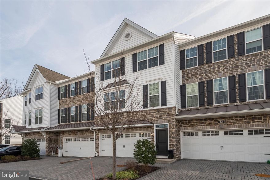 Welcome to 203 Corvus Circle in the sought-after Ravenscliff community of Media! This stunning Toll Brothers carriage-style townhome offers the perfect blend of modern luxury, comfort, and convenience. Built in 2018, this beautifully maintained 3-bedroom, 2.5-bath home features nearly 2,800 square feet of thoughtfully designed living space with an open-concept floor plan ideal for everyday living and entertaining.

The sun-drenched main level showcases gleaming hardwood floors, a spacious living area with a cozy gas fireplace, and a gourmet kitchen complete with stainless steel appliances, oversized island seating, abundant cabinetry, and stylish finishes throughout. Enjoy seamless indoor-outdoor living with two private decks — perfect for grilling, relaxing, or hosting guests.

Upstairs, the expansive primary suite serves as a private retreat with a large walk-in closet and spa-inspired bath featuring dual vanities and an oversized shower. Two additional generously sized bedrooms, a full hall bath, and convenient upper-level laundry complete the bedroom floor.

The lower level offers incredible flexibility with a bonus living space ideal for a home office, gym, media room, or playroom, plus a walk-out basement with soaring ceilings ready for future finishing possibilities. Additional highlights include a 2-car garage, zoned HVAC, and low-maintenance living with HOA-covered lawn care and exterior maintenance.

Located just minutes from downtown Media’s vibrant restaurants, shops, and train stations, with easy access to Routes 1, 476, Philadelphia International Airport, and Center City. Not to mention Rosetree Park and Dining Under the Stars waiting for you to enjoy this summer. This exceptional home delivers luxury living in one of Delaware County’s most desirable communities.