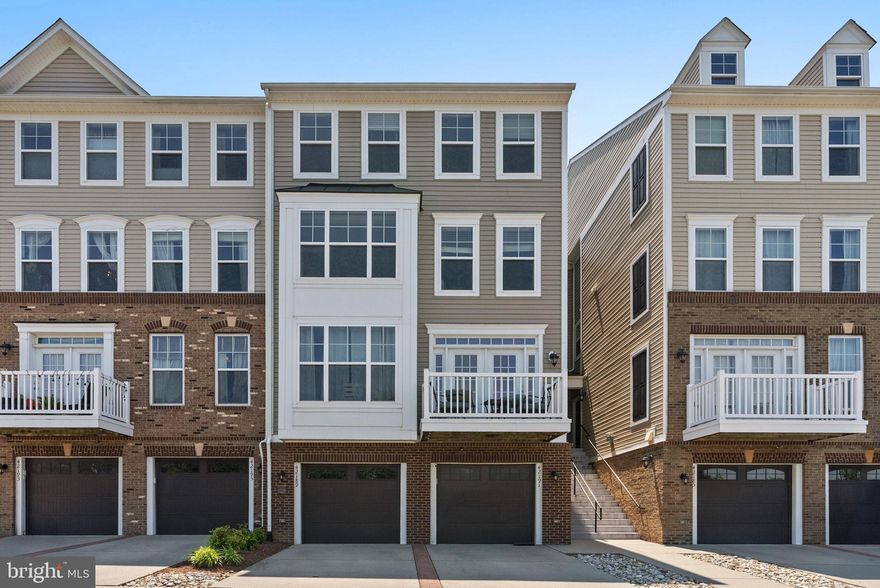 Welcome to 42189 Shorecrest Terrace, a beautifully upgraded former model home in the coveted Summerwalk at Stone Ridge community in Aldie, VA. This rarely available 4-level townhouse-style condominium boasts 2,208 square feet, offering one of the largest floorplans in the neighborhood. With 3 spacious bedrooms, 2 full baths, and 2 half baths, this home combines luxury and functionality. The lower level features luxury vinyl plank flooring, a wet bar, half bath, and walk-out access to the yard—perfect for entertaining or relaxing. The main entry level on the second floor showcases hardwood floors, crown molding, a bright open layout, and a modern kitchen with quartz countertops, stainless steel appliances, a walk-in pantry, large island, and access to a private deck. The third level includes two generously sized bedrooms with luxury vinyl plank flooring and a hall bath. The top-level primary suite is a private retreat with LVP flooring, a massive walk-in closet, and a spa-inspired en suite bath featuring dual vanities, a soaking tub, separate shower, and private water closet. As part of the Stone Ridge HOA, enjoy access to premier amenities including three pools, a fitness center, clubhouse, tennis and basketball courts, playgrounds, walking trails, and an amphitheater for community events. This is luxury living in a vibrant, amenity-rich neighborhood—don’t miss your opportunity to call this exceptional home yours.