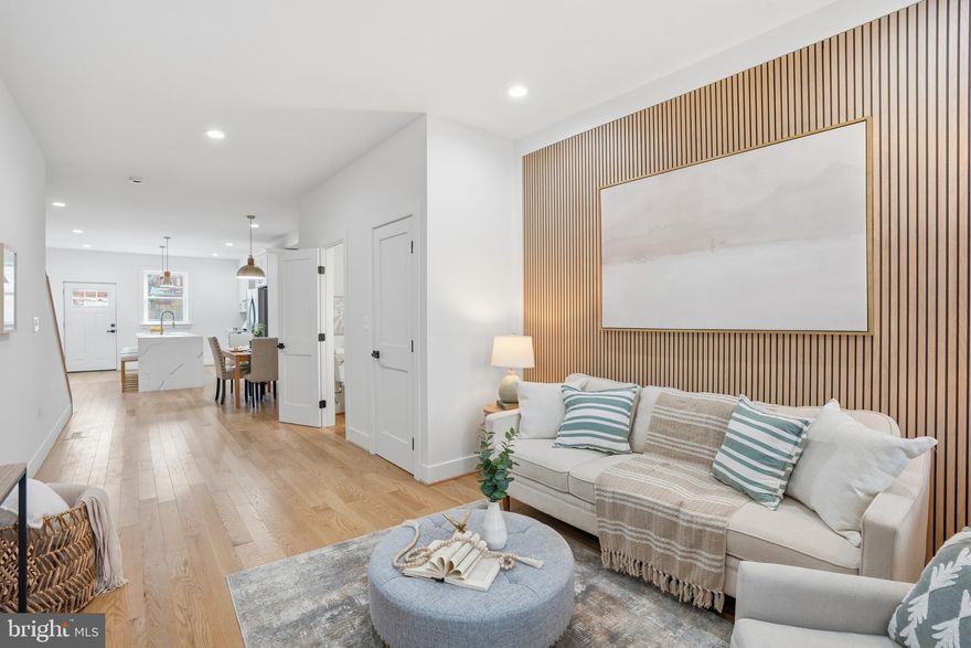 One of a kind, new luxury townhome in the Heart of Hampden –70 day completion. See Model Home next door for finish options. Customize all of your own finishes if you choose. Welcome to your Hampden dream home in one of Baltimore’s most vibrant and walkable neighborhoods! This newly constructed five-bedroom, three-and-a-half-bathroom townhome offers modern living just steps from The Rotunda, The Avenue, and Johns Hopkins University. Includes off-street parking! Designed with space, function, and style in mind, this home features 9-foot ceilings on the 1st floor, hardwood floors and luxury tile finishes, an expansive rooftop deck with sweeping city views, multiple outdoor living spaces - including a deck off the kitchen and a rear patio. Choose the versatile lower-level au pair suite option which includes two separate entrances, a full kitchen, laundry, and private bath—perfect for guests, rental income, or multigenerational living. Additional highlights include: Two-zone HVAC for maximum comfort/fully insulated walls for energy efficiency and soundproofing. You have the chance to have custom built out closet interiors. This won’t last long!