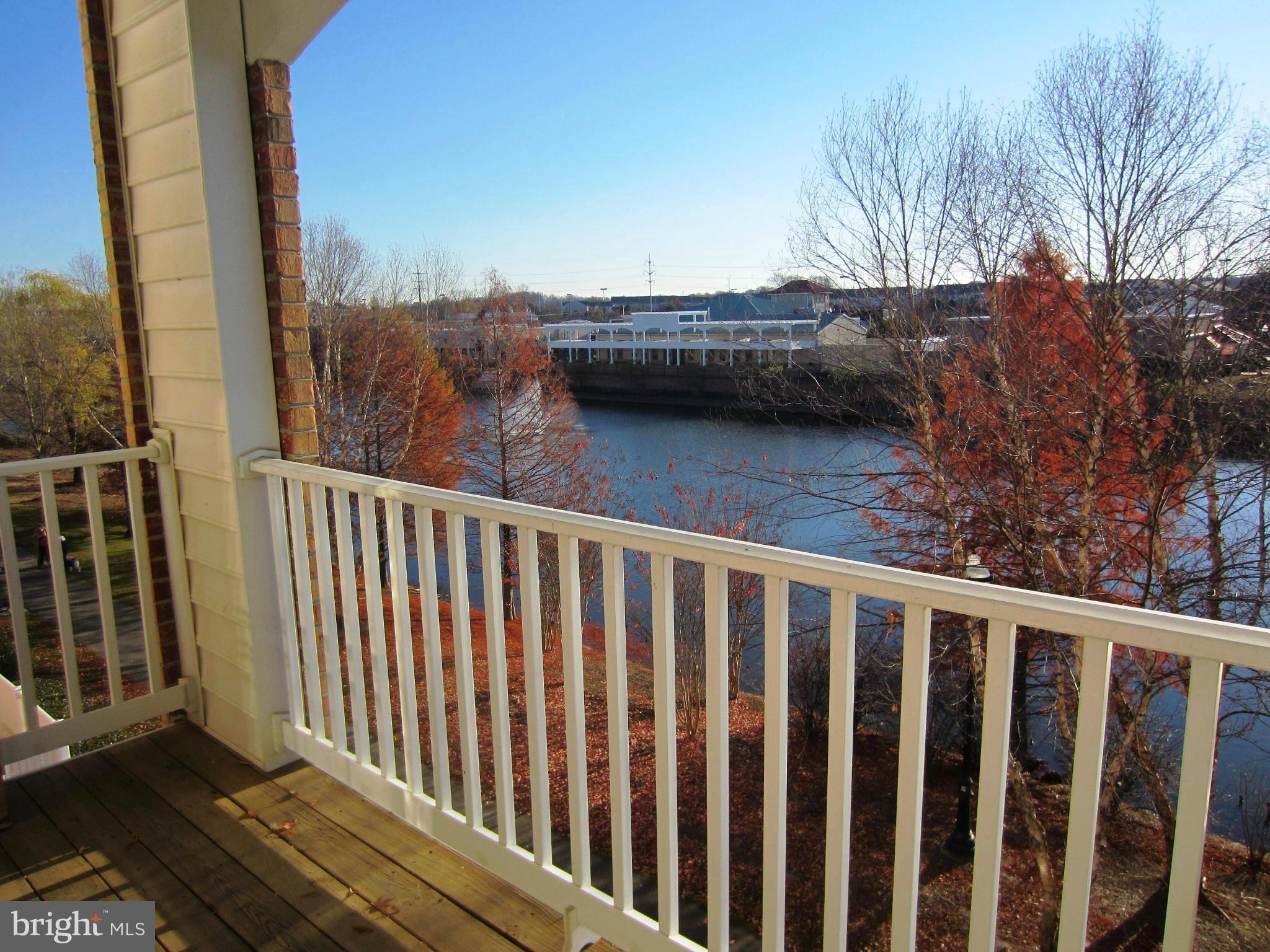 Waterfront condo! Built in microwave, fridge with ice/water dispenser, dishwasher, full size washer and dryer, & stove; spacious balcony overlooking the lake. Secured 55+ building with elevator, social activities, and nearby shops, restaurants, and doctor's offices. Underground parking space AND a rare, separate, large storage space. Water included.