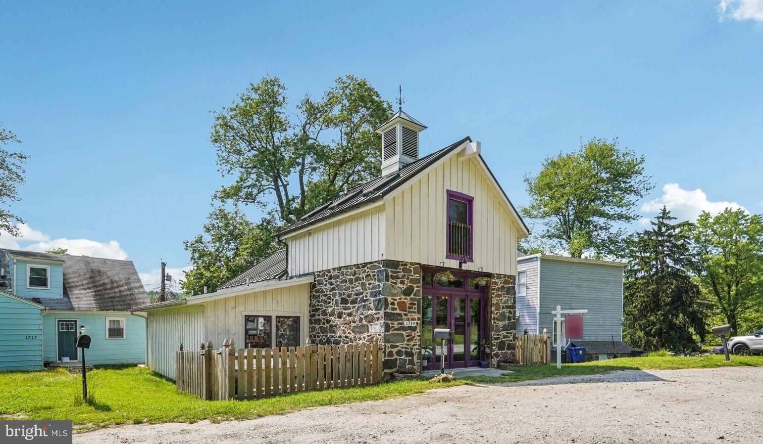 Utterly Unique 19th Century Two-Story in Franklintown Historic District! Originally Built as an Ice House and Converted to a Residence, this Home exudes Character in every room! Enter through Glass Double Doors to Updated Kitchen & Dining Room. Kitchen features Crisp White Casework, Granite Counters, Stainless Appliances, Ceramic Tile, and Original Stonework Backsplash. Airy & Bright Living Room with Hardwood Floors & Built In Bookcase. Two Large Bedrooms and Updated Full Hall Bath Complete the Main Level. Upper Level Loft Bedroom with Vaulted, Original Exposed Timbered Ceiling and Walk-In Closet, and Updated Full Bath. Lower Level Primary Suite, with Dual Walk-In Closets and Huge Updated Bath with Dual Vanity, Jetted Tub, Large Walk-In Shower and Private Water Closet with Sink. Basement features Storage and the Original Ice Room – a Two Story, Totally Stonework Vault with Countless Interesting Possibilities! Large, Level, Fully Fenced Rear Yard. All Mechanics (Windows, Roof, HWH, HVAC) Believed to be Replaced with 2018 Renovation. Easy access to I-70 and 695 – only .6m to Security Park & Ride and .8m to Gwynns Falls Trailhead. VA Assumable loan with apx $135K balance at 2.25% - buyer must use own eligibility.