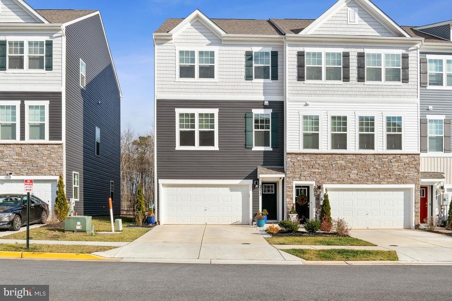AVAILABLE IMMEDIATELY!! Welcome to 2073 Hinshaw Dr., a beautiful end unit townhome in the newer community of ODENTON TOWN CENTER for rent. This 3-level townhome with 2 car garage features a large recreation room on the lower floor with access to the deck for outdoor activities. The kitchen on the first level is equipped with an island and dining-room, which leads to a living room and a half bathroom. The deck in the main level with tree views offers the privacy. The upper-level features three bedrooms, two full bathrooms and a laundry room. The master suite includes a walk-in closet and luxurious bathroom with double sinks. This home is conveniently located to major commuter routes, restaurants, mall, and shopping areas, and is minutes away from Fort Meade, NSA, Marc Train and Arundel Mills Shopping Mall. Easy access to all major highways. Don’t miss this true gem!