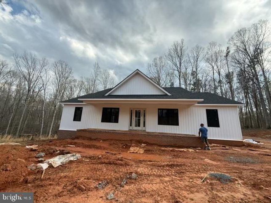 Builders and investors — this is a fantastic opportunity to complete and customize a home already well underway. Situated on 4 beautiful acres in a highly desirable location near the Town of Louisa and convenient to Interstate 64, this 3-bedroom home features completed exterior work including architectural shingles, vinyl siding, a finished front porch, and a new well with pump already installed. The interior is ready for your vision and finishing touches, with drywall, plumbing, electrical, septic system, and interior completion still needed. All inspections have been completed and a 3-bedroom perc test has already been approved. Whether you’re looking for your next investment project or the chance to create your dream home, the possibilities here are endless. This is a cash only deal, no financing available.