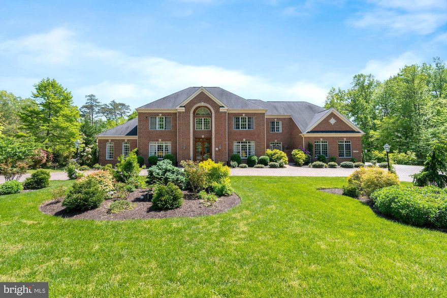 Welcome home to 11408 Wolfs Landing, located in Fairfax County's sought after Fairfax Station located about 22 miles southwest of Washington DC.  This part of Fairfax Station is a haven among rolling hills and tranquil wooded scenic Vistas.    11408 Wolfs Landing is EXCEPTIONALLY well-priced home.  Stately brick custom colonial nestled on beautiful 5 acres, with over 10,000 sq. ft. of living space, 4 CAR SIDE LOAD GARAGE, 6 bedrooms, 5 full baths, 2 half baths, 3 fire-places, 2 laundry rooms and much more. Main level offers 2 story grand foyer, inviting formal living room with fire place, formal dining room, 2 story great room with fire place and floor to ceiling windows bringing the outside in, a large conservatory with high ceilings, a bed room, large gourmet kitchen with enormous counter space and abundance of cherry cabinets, separate eat-in area and a sitting room, 2nd entrance and mudroom area, 2 half baths. Upper level hosts a large primary suite with its own foyer, sitting area, 2 custom- built closets, a large luxury bath with 2 separate vanities, a large soaking tub, a steam shower and a private water closet. 3 ensuites with updated private baths and custom closets and a bedroom level laundry room. Enormous Lower level is perfect for entertaining.  Private Guest Suite with large closet and attached full bath and a separate laundry room. Very open recreation room is great for entertaining. Enough space for pool table, air hockey, foosball table, ping-pong or games of your choice or just relax by the fire place. Beautiful upgraded custom wet bar, luxurious home theater to enjoy movies or games. Separate sitting room with walk-out patio. Well thought out outdoors to enjoy nature at its best. Many fruit trees - 2 sour cherry, 4 persimmons, 2 peach, 2 apple, 2 Cherry, 1 pear- planted around the property. A large composite deck with built-in propane gas grill and a separate charcoal grill - perfect for summer outdoor family time and entertaining. Many updates done by current owners throughout years of their ownership. Enormous paver’s circular driveway was added. 22 KW Generator added in  2013-2014, New Hot Water Heater 2019, HVAC for upper level replaced   6 years ago, lower level Furnace replaced  6 years ago., bedroom level carpet replaced 2017. Looking for open spaces throughout the house, large rooms, need more home office space…..This is a home that will give everyone their own space while working or schooling at home. Simply it's a Gorgeous Home! It's your chance to enjoy this home with your family and friends. All CDC GUIDELINES to be followed during touring the house. Please everyone visiting the house wear MASK, Remove Shoes or wear Shoe Covers, Use Hand Sanitizer and wear Gloves provided in the foyer.  Shown by appointment only.