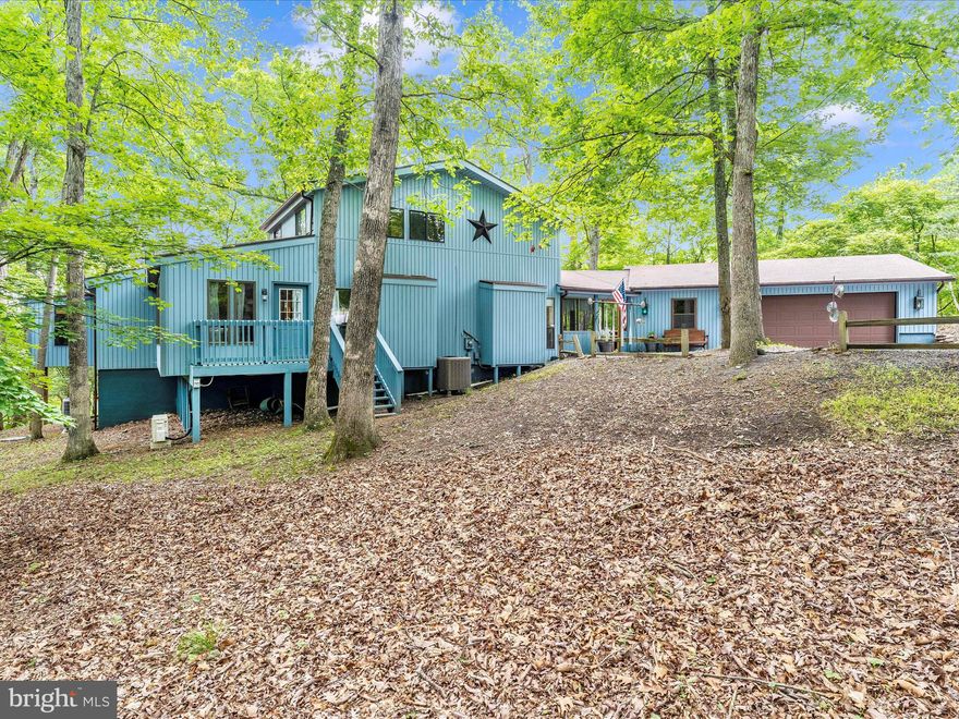 Located at the end of a private cul-de-sac in The Woods, this beautiful treed home site offers a ton of privacy.  Features include an attached oversized 2 car garage with extra workspace, open concept living/dining/kitchen with a window wall, soaring cathedral ceilings, wood burning fireplace, hardwood flooring throughout, updated kitchen that includes Silestone countertops, lots of cabinets, huge pantry + a stainless appliance package.  The first floor primary suite contains enough space for a nice sitting area, full bath with walk-in shower, double sink vanity + huge closet.  A second bedroom on main level has an attached full bath, laundry room + a stunning sunroom with lots of windows and a wood plank ceiling complete the main level.  The upper level loft serves as a large third bedroom or an office/sitting room with its own full bath containing skylights + a walk-in closet.  The finished, walk-out lower level contains a nice rec room, an additional half bath + extra storage.  A screened-in breezeway + an exterior rear facing deck provides lots of opportunities for outdoor entertaining.  Schedule your visit today.