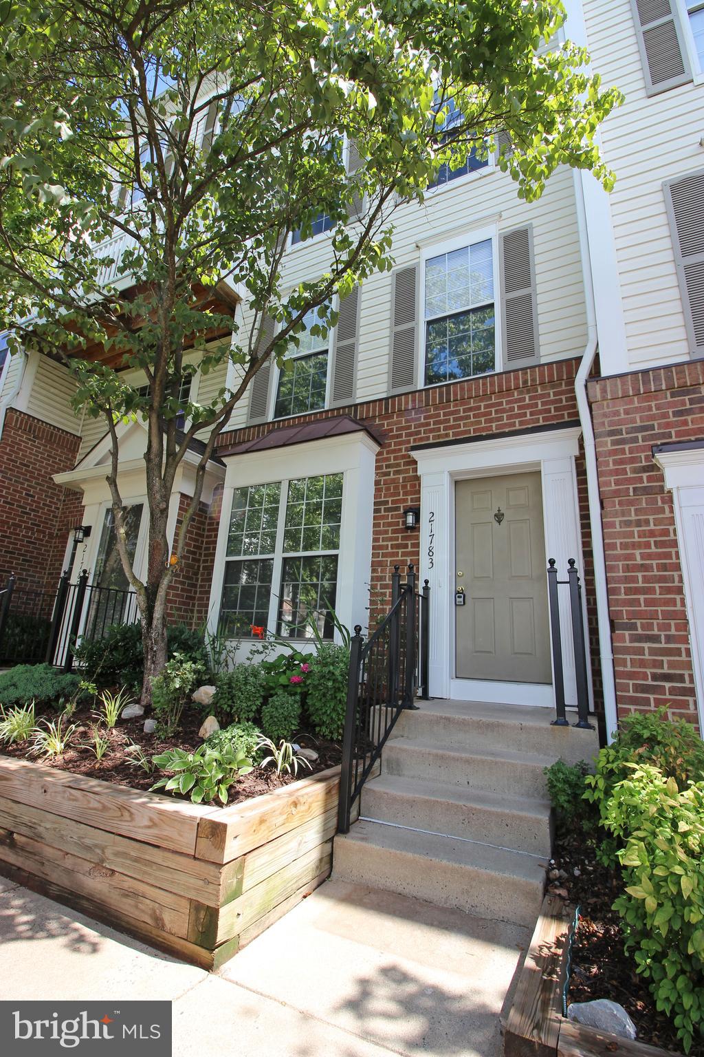 Stunning 2 Bedroom 2.5 Bath 2 Level Townhome in Sterling! Entering this amazing home, you are welcomed by the gorgeous brand new laminate flooring, found throughout the first level. The kitchen is next, boasting high-quality stainless steel appliances, new countertops, ample cabinet space & a great space for a breakfast nook. The spacious living room/dining room is next, and here you can find the decorative fireplace, beautiful light fixture & access to the private patio. Heading upstairs, you will find the bedrooms, each with wall to wall carpeting, generous closet space & ample natural light. The Primary Bedroom features access to a balcony, perfect for relaxing after a long day or a serene start to the morning. Enjoy the comforts of an in-unit washer & dryer, permitted parking spaces & convenient access to 66 & 495. Available 8/1!