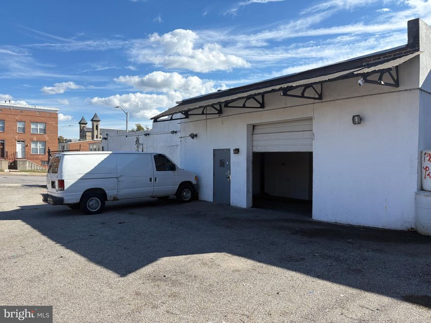712 Homewood Ave/712 E Eager St: Discover endless possibilities with this versatile warehouse property at 1020 Homewood Ave! Offering over 2,400 sq. ft. of functional space, this building features two large garage doors, ideal for automotive, storage, or light industrial use. Previously operated as an auto mechanic shop, it’s perfectly suited for similar businesses or flexible commercial needs. The property includes a spacious parking lot, secured electric perimeter fencing, and a private office with its own restroom, providing convenience and security. Located in a highly accessible Baltimore area, this site combines practicality, visibility, and functionality — ready for your next business venture!