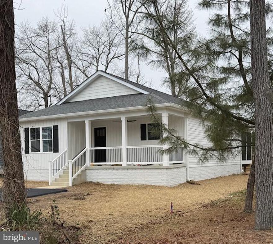 Classic Shores New Construction in the Town of Colonial Beach. Golf Cart approved community and a short ride to Town Beaches, Restaurants, Entertainment, and more
Austin Model one level living with Front Porch and Rear Screened Deck.
3 Bedrooms and 2 Full Baths, Private bath in primary Bedroom includes walk-in Shower.
Light filled Kitchen with Island, hard surfaced counters, Stainless Appliances, Recessed Lighting, Popular LVP flooring, and more.  Hard Surface LVP flooring with carpet in Bedrooms. Photos of similar house plan.