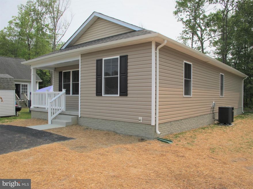 Classic Shores New Construction in the Town of Colonial Beach. Golf Cart approved community and a short ride to Town Beaches, Restaurants, Entertainment, and more
Austin Model one level living with Front Porch and Rear Screened Deck.
3 Bedrooms and 2 Full Baths, Private bath in primary Bedroom includes walk-in Shower.
Light filled Kitchen with Island, hard surfaced counters, Stainless Appliances, Recessed Lighting, Popular LVP flooring, and more.  Hard Surface LVP flooring with carpet in Bedrooms. Buy now and complete final selections. Completion scheduled by Thanksgiving. Photos of similar house plan. More photos coming soon.