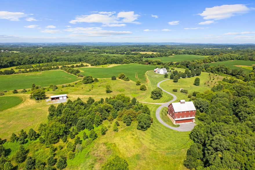 Stoney Springs Farm is unique, recreational, and extraordinary - 315+/- acres crafted for car collectors, hunters, equestrians, and agritourism visionaries alike.  Just 30 miles from Washington, DC, the property commands breathtaking panoramic views stretching from Sugarloaf Mountain to downtown Bethesda. For car enthusiasts or large-scale entertaining, the centerpiece is a masterfully BOWA built, timber-framed bank barn.  Spanning 8,200 square feet on three secure and climate-controlled levels, it features Douglas Fir beams and flooring, commercial-grade capability including a chain hoist and hydraulic lift, a full kitchen with high-end appliances, 1.5 baths, and the infrastructure to showcase and care for a collection of up to 20 exotic cars.  This estate also caters to the huntsman, offering mature woods, open fields, and strategically placed stands and food plots creating exceptional habitat and trophy opportunities.  The custom built, 4-bedroom, 3.5 bath colonial farmhouse is comprised of 4,800 finished square feet and features a coveted main level primary bedroom suite, a gourmet quintessential country kitchen with top-of-line appliances, gorgeous reclaimed oak floors, custom millwork, an oversized and versatile upper bonus room with rear staircase, inviting front and rear covered porches offering tranquil vista and spectacular sunsets, and is equipped with Geothermal HVAC.  Completing this unparalleled  property is a detached three-car garage with workroom and covered porch, and a substantial and functional four-bay agricultural building.  There are two high-producing wells, multiple productive crop fields and cultivable land, and is perc approved for an additional 6-bedroom house.  Nationally acclaimed magnet Poolesville High School and an array of restaurants are located less than three miles away. Thoughtfully designed and built from the finest materials, with two distinct visions, this incredible and vast property now invites a new owner to write the next chapter. This is more than real estate – it’s an opportunity to curate your own recreational oasis and enduring legacy!

*NOTE: There is no sign on property,  and please do not walk or drive on property without permission from listing agent.