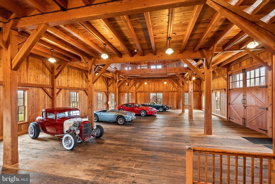 Stoney Springs Farm is unique, recreational, and extraordinary - 315+/- acres crafted for car collectors, hunters, equestrians, and agritourism visionaries alike.  Just 30 miles from Washington, DC, the property commands breathtaking panoramic views stretching from Sugarloaf Mountain to downtown Bethesda. For car enthusiasts or large-scale entertaining, the centerpiece is a masterfully BOWA built, timber-framed bank barn.  Spanning 8,200 square feet on three secure and climate-controlled levels, it features Douglas Fir beams and flooring, commercial-grade capability including a chain hoist and hydraulic lift, a full kitchen with high-end appliances, 1.5 baths, and the infrastructure to showcase and care for a collection of up to 20 exotic cars.  This estate also caters to the huntsman, offering mature woods, open fields, and strategically placed stands and food plots creating exceptional habitat and trophy opportunities.  The custom built, 4-bedroom, 3.5 bath colonial farmhouse is comprised of 4,800 finished square feet and features a coveted main level primary bedroom suite, a gourmet quintessential country kitchen with top-of-line appliances, gorgeous reclaimed oak floors, custom millwork, an oversized and versatile upper bonus room with rear staircase, inviting front and rear covered porches offering tranquil vista and spectacular sunsets, and is equipped with Geothermal HVAC.  Completing this unparalleled  property is a detached three-car garage with workroom and covered porch, and a substantial and functional four-bay agricultural building.  There are two high-producing wells, multiple productive crop fields and cultivable land, and is perc approved for an additional 6-bedroom house.  Nationally acclaimed magnet Poolesville High School and an array of restaurants are located less than three miles away. Thoughtfully designed and built from the finest materials, with two distinct visions, this incredible and vast property now invites a new owner to write the next chapter. This is more than real estate – it’s an opportunity to curate your own recreational oasis and enduring legacy!

*NOTE: There is no sign on property,  and please do not walk or drive on property without permission from listing agent.