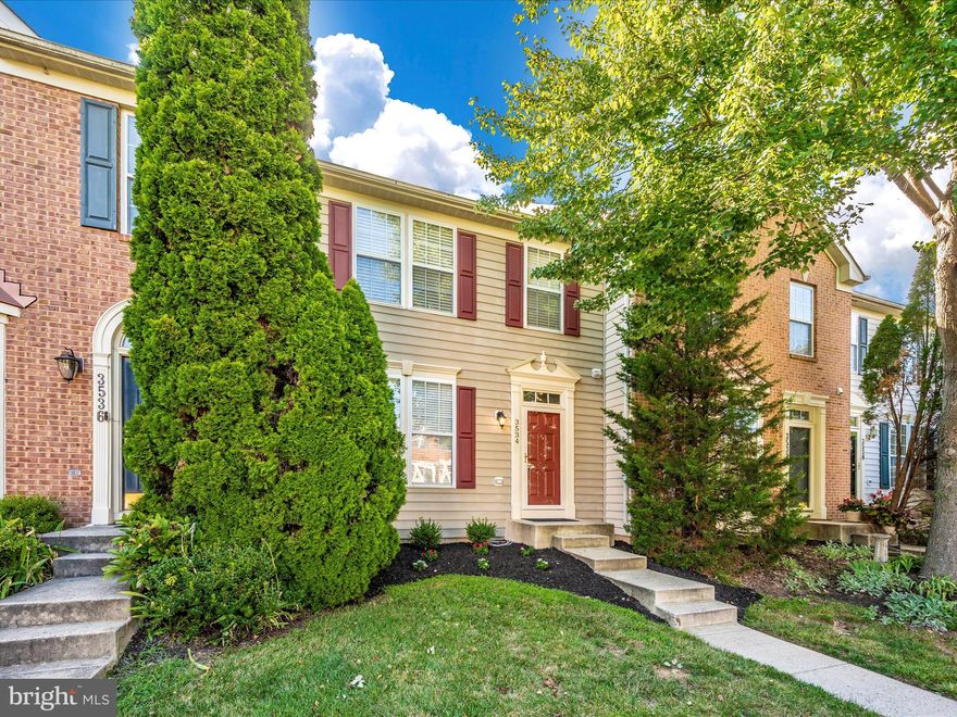 Welcome to your dream townhome in the highly sought-after Villages of Urbana community! This stunning interior unit is sure to impress from the moment you step inside. The open floor plan is bathed in natural light, showcasing freshly painted walls in a neutral palette and new, light-colored laminate flooring that adds a modern touch throughout the home.

The inviting foyer, complete with a convenient half bath, flows seamlessly into the spacious living room, where the carpeted staircase leads to the upper level. At the heart of the home is the chef’s kitchen, featuring meticulously maintained pine cabinetry, exquisite top-of-the-line granite countertops, and stainless steel appliances to include a gas stove. There is a large island, along with ample table space that makes this kitchen an entertainer’s delight.

The kitchen extends into a versatile bump-out area, perfect for a cozy sitting room, home office, or any creative space you envision. Step through the french doors to enjoy your private backyard retreat on a brand-new Trex deck that backs to serene trees, offering the ideal spot for relaxation.

Upstairs, the expansive master suite awaits with a walk-in closet and a luxurious en-suite bath, complete with a soaking tub and separate shower. Two additional bedrooms and a second full bath round out this level, all with the same elegant laminate flooring found throughout the home—meaning very little carpet to worry about!

The lower level features a spacious rec room with walkout access to the backyard, offering plenty of room for entertainment or relaxation. There’s also an unfinished area, providing the potential to add a fourth bedroom in the future.

This immaculate, move-in-ready townhome is sure to please even the most discerning buyers. Don't miss your chance to make this exceptional property your new home!