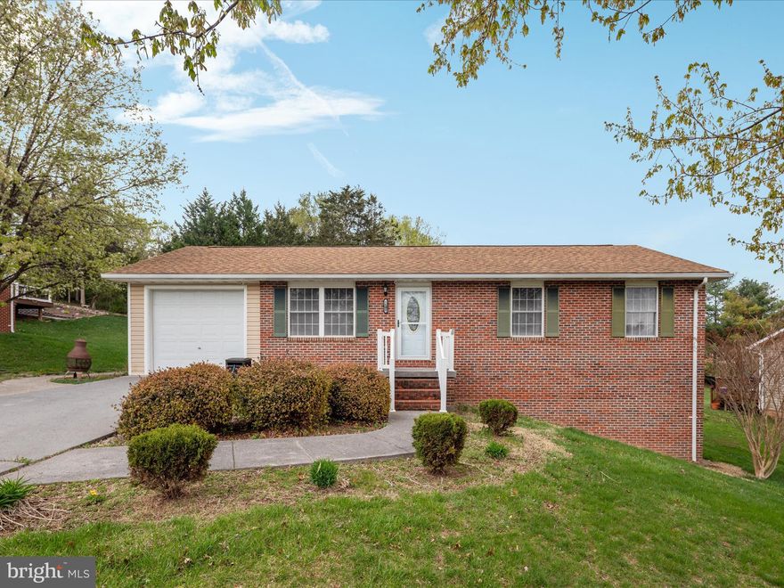 Welcome home to 1190 S Fork Drive!  A charming brick rancher, well located close to town and on a generous lot.  The main level of this cheerful home boasts a bright and airy living area, a sweet kitchen with plenty of cabinet and counter space and open to the dedicated dining area, plus three bedrooms and two full bathrooms.  The full basement offers loads of extra space, including a recreation room, flex room/guest space, and an additional full bathroom.  Beautiful yard with a spacious deck and storage shed.  One car garage and ample driveway for additional parking.  The perfect cozy home!