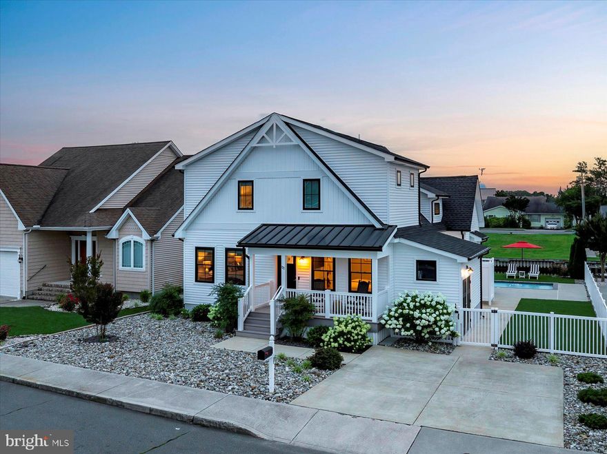 Welcome to your dream beach home! Built in 2019, this stunning custom-designed 4-bedroom waterfront home offers the perfect blend of modern luxury and laid-back beach living. Beautifully styled and decorated, this home is being sold fully furnished.  Nestled just moments from the sand with a heated, saltwater pool and direct boat access, making this home a true paradise for water lovers.  Step inside to discover bright, open concept living space with high-end finishes, cathedral ceilings and a gas fireplace.  The chef’s kitchen features GE Café appliances, tile backsplash and a large quartz island.  Enjoy the convenience of first floor living with two entry-level bedrooms, including the primary suite.  Seamless indoor-outdoor flow, perfect for entertaining or relaxing in your own slice of paradise.  The backyard is highlighted by the sparkling pool, low maintenance landscaping, private outdoor shower and large attached storage shed.  New bulkhead in 2019 with 60 ft of composite dock and boardwalk.  This beach home has been meticulously maintained by the original owners and never rented.  Whether you’re soaking up the sun, launching your boat, or strolling to the nearby beach, this property offers an unmatched lifestyle on the water.