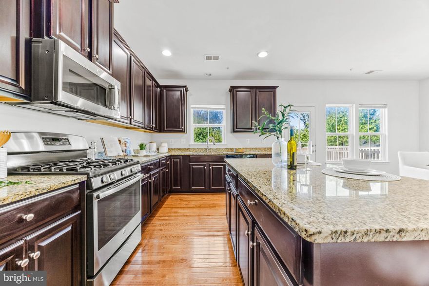 *Open house Sun 12-2*  Why settle for the interior, when you can have the END UNIT?  Why look at other homes from your deck and sacrifice privacy when you can BACK TO WOODS?  Don't settle when you can have it all in this 24-foot-wide, 2-car garage home with single-family-scale spaces, from the owner's suite that easily fits a king bed plus furniture, to the huge great room, and fabulous kitchen with tons of cabinetry and pantry, and secondary bedrooms that actually fit furniture.  All this, plus higher quality carpet than the builder offers, and a new HVAC unit just installed!  Creekside Village has NO front foot fee (save thousands!) and is an active, vibrant community with regular food truck nights at the clubhouse, pool (which is less than a 5-minute walk from your new home), fitness center, dog parks, and playgrounds for $101/month. Only 20 min. to Ft Meade, Baltimore, or BWI airport!