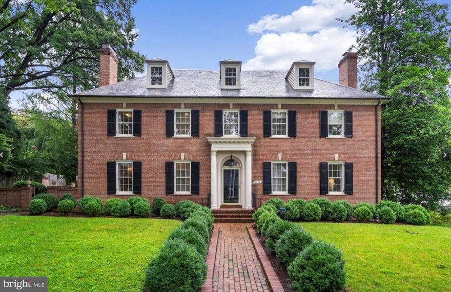 This gracious Georgian Colonial is ideally situated on a generous .23-acre flat corner lot, on one of the most desirable streets in the nation's capital. Mature rows of boxwoods surround the facade, which is set back from the street, providing privacy and impressive curb appeal. Originally built in 1946, the house has undergone extensive renovations with the highest quality fixtures and finishes throughout. The residence offers rooms which flow for elegant entertaining and large spaces for comfortable family living, all of which are filled with an abundance of natural sunlight. The gracious foyer is flanked by a study and formal living room, each with welcoming fireplaces. The circular flow to the rear of the house provides seamless transition to the main living spaces. The sophisticated dining room is beautifully scaled with French doors opening onto the rear private garden. Adjacent is the well-appointed chef's kitchen with premium countertops, Zub-Zero refrigerator, custom cabinetry, and large, sun-filled windows. There is also a large paneled family room/library on this floor with walls of windows overlooking a koi pond, as well as the added convenience of an attractive marble powder room. A lovely staircase leads to the second level, which offers four bedrooms and three full bathrooms. The luxurious primary suite expansively covers the width of the house and overlooks the rear yard and gardens. It offers deep closets, and an en-suite bathroom with dual marble vanities, and a frameless glass shower. All of the additional bedrooms on this floor are spacious and all bathrooms have been beautifully updated. The third floor serves as an additional bedroom suite with a luxurious bathroom and ample closets. The lower level of the residence has a large recreation room with a wet bar, custom built-ins and a wood-burning fireplace. It adjoins a lower level fitness room, which could serve as an additional bedroom. This level also offers a full bathroom, a spacious laundry room with utility sink and storage. There is access from the lower level to the large two-car garage, with additional space for bikes and gear. The exterior of the property has been expanded to include a flagstone terrace with an outdoor fireplace and multiple entertaining areas. Located just minutes from Georgetown, Virginia, and Maryland, as well as easy access to all area airports, this home is a rare opportunity to own a beautifully preserved and extensively updated architectural gem in one of Washington’s most sought-after neighborhoods.