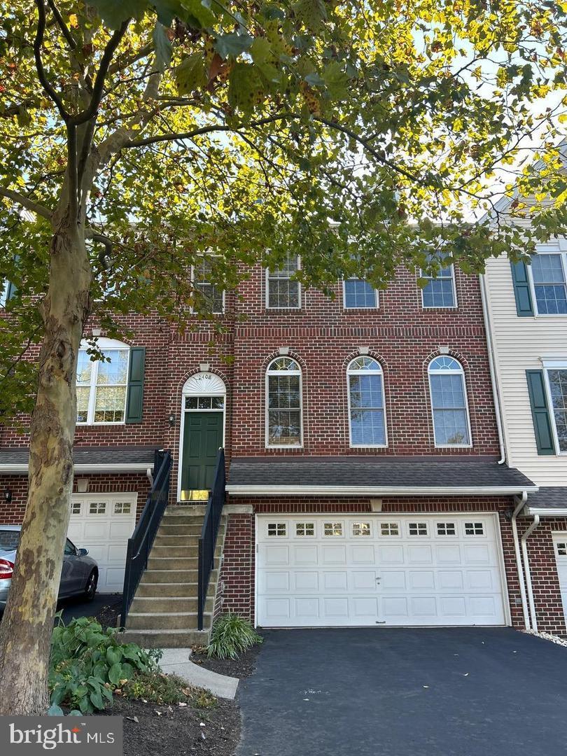 This beautifully maintained brick front townhome in Arbor Point is a must-see! The community is well-kept, and the home features stunning hardwood floors throughout the first floor. The open floor plan allows for plenty of natural light, enhancing the inviting atmosphere. The remodeled kitchen is a chef's dream, complete with granite countertops, stainless Bosch appliances, and a center island, perfect for gatherings. Adjacent to the kitchen, you'll find a cozy family room with a fireplace, ideal for relaxing evenings. On the second floor, you'll discover 3 spacious bedrooms, including a large owners suite with vaulted ceilings, a private bathroom and oversized closets. The convenience of a laundry area on this floor adds to the home's appeal. 2 other bedrooms share a full hall bath. The lower level offers flexibility for an at-home office or game room and includes a half bathroom, making it a great multi-functional space. Additionally, the huge two-car garage comes with extra storage space. With a monthly HOA fee (covered by the landlord) that grants access to the community poo, playground and rec center, this home offers both comfort and community amenities. 2 NEW A/C systems being installed as well as 2 new toilets.