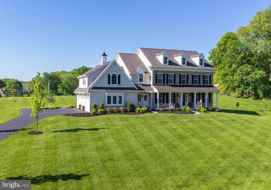 Unicorns really do exist!  Located in the award-winning Unionville-Chadds Ford School District, this 2-year-young quintessential Chester County Farmhouse is perfectly situated high upon it's 2+ acre homesite and absolutely brimming with curb appeal!  Upon ascending the sweeping tree-lined drive, guests are welcomed onto a gracious front porch overlooking the pastoral landscape and rolling prairie that surrounds this stunning residence.  Once inside, the classic beauty of the home's exterior is complimented by a modern take on the traditional farmhouse aesthetic; large dramatic windows bring in abundant natural light to each space, warm wide plank hardwood flooring extends throughout the first floor and second floor hallways and a light neutral color palette offers a blank slate for the next Buyer's personalization!  The open-concept floor plan features a beautifully-appointed "Chef's Kitchen" with an oversized center island providing a perfect gathering space to enjoy relaxing or entertaining with family and friends.  The warm and inviting Family Room is accented by a coffered ceiling and cozy gas-burning fireplace featuring a custom brick and shiplap surround.  From the Family Room, a small hallway leads to a private Powder Room and spacious Study, which also opens to the Foyer.  An elegant Butler's Pantry is accessible from the Kitchen and Dining Rooms, and includes refrigerated wine storage and additional cabinetry for serving pieces and barware, etc.   Upstairs, the spacious Owner's Suite enjoys beautiful views of the rear grounds and offers a spacious Bedroom with tray ceiling, two generously-sized closets and an en-suite Master Bath with dual vanities, large shower and free-standing tub.  A charming window seat on the second floor landing provides a cozy reading nook adjacent to a beautifully-appointed second bedroom with private en-suite Bath and walk-in closet.  Two additional generously-proportioned Bedrooms share Bath #3; one with direct access and one accessible from across the hall.  A convenient Laundry Room completes the second floor, however a great surprise awaits!  In need of a 5th Bedroom, Au-Pair or In-Law Suite?  This thoughtfully-designed residence features a large finished space over the garage, accessible from a private stairwell off of the Mudroom!  The Sellers recently finished this wonderful space for use as a private office, but with the simple addition of a closet it could easily be converted to a 5th Bedroom or Suite... the possibilities are endless!  Speaking of possibilities, a full unfinished basement provides another wonderful opportunity for the next lucky Owner to bring their own unique vision for the space, which features upgraded 9' poured concrete walls and rough-plumbing for a future Powder Room.  Outside an incredible private backyard oasis awaits; a French Door leading from the rear Center Hall between the Kitchen and Family Room opens onto a large composite deck offering plenty of space for outdoor living, dining, grilling and entertaining.  Grab some marshmallows and follow the hardscape path to the top of the hill, where you'll enjoy taking in the breathtaking scenery or unparalleled views of the renowned Longwood Fireworks displays on a warm Summer evening!  This stunning property perfectly exemplifies the Chester County lifestyle, nestled into the rolling landscape and nature that surrounds it while offering convenient access to many desirable destinations, such as Kennett Square, West Chester, Wilmington, Exton, Longwood Gardens, Winterthur and major area commuting arteries such as Rt. 202, Rt. 1, Rt. 52 and I95.  Due to a corporate relocation, this exciting opportunity now exists for a new Owner to love and enjoy this very special property just as much as the current Owners have.  This home truly is the Unicorn you've been waiting for... but the thing about Unicorns is, they don't stick around for long!