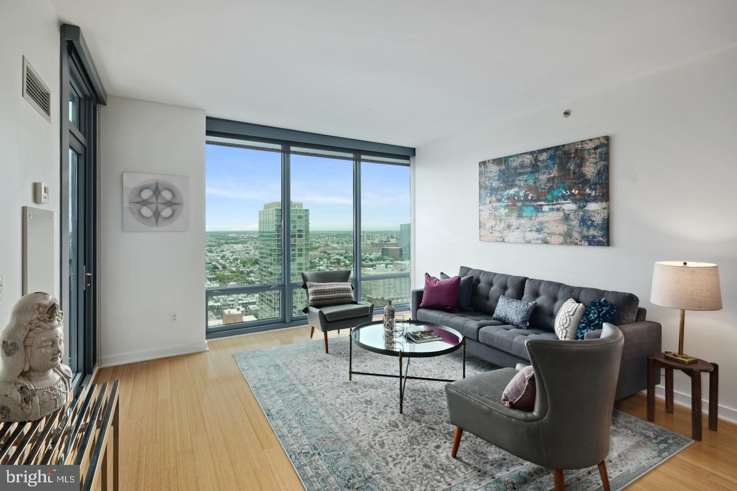 Welcome to Murano Unit 3605, a rarely offered one-bedroom, one-bath residence featuring the coveted "05" layout with soaring south-facing views from the 36th floor. This 822 sq. ft. unit offers a sleek and modern lifestyle in one of Philadelphia's most desirable full-service buildings. Enjoy an open-concept living space with floor-to-ceiling windows, hardwood floors, and a private balcony that overlooks the shimmering skyline and captures breathtaking natural light throughout the day. The chef's kitchen is outfitted with stainless steel appliances, granite countertops, and rich cabinetry--perfect for entertaining or quiet evenings at home. The spacious primary bedroom features custom closet space and connects to a spa-like bathroom with marble finishes, a soaking tub, and a separate glass-enclosed shower. Additional features include in-unit laundry, solar and blackout shades, and one-car deeded garage parking. A dedicated storage unit is also included. The Murano offers exceptional amenities: a 24-hour concierge, indoor heated lap pool, state-of-the-art fitness center, sun deck, resident lounge, and more. The monthly HOA covers water, gas, building maintenance, and all amenities, making for truly effortless living. Ideally located just steps from Trader Joe's, 30th Street Station, Rittenhouse Square, and the Schuylkill River Trail, this is urban living at its finest. Don't miss your chance to own this high-floor gem with iconic views and every convenience at your fingertips. Schedule your private tour today! *UNIT PICS ARE OF ANOTHER SAME LAYOUT UNIT. SUBJECT UNIT IS OF A HIGHER FLOOR VIEW*