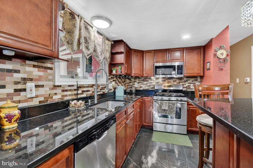 Nestled in the serene Forest Park subdivision, this stunning Colonial-style residence has undergone a major renovation in 2022, blending timeless elegance with modern luxury. Spanning 3893 square feet, this home offers an inviting atmosphere that is perfect for both relaxation and entertaining. Step inside to discover a beautifully designed interior featuring four spacious bedrooms and four and a half bathrooms. The lower level has 3 additional bonus rooms. The heart of the home is the gourmet kitchen, complete with a large island, upgraded countertops, and energy-efficient appliances, including a built-in range and microwave. The second kitchen adds versatility for culinary enthusiasts or entertaining guests. Recessed lighting throughout enhances the ambiance, while the cozy fireplace in the living area invites warmth and comfort during cooler evenings. The master suite is a true retreat, boasting a walk-in closet and an en-suite bathroom that exudes luxury. Each additional bedroom offers ample space and comfort, ensuring everyone has their own sanctuary. The fully finished basement, with a walkout level, provides additional living space, perfect for a game room or home theater. Outside, the property is equally impressive. The expansive wrap-around porch and multiple patios create inviting outdoor spaces for gatherings or quiet moments of reflection. The meticulously maintained yard features secure storage and flood lights for added safety and convenience. A charming cabana/pool house adds a unique touch, perfect for hosting summer barbecues or enjoying a peaceful afternoon. Safety and security are paramount, with a comprehensive security system that includes exterior cameras, motion detectors, and smoke detectors, ensuring peace of mind for you and your loved ones. With a concrete driveway accommodating multiple vehicles, this home is as practical as it is beautiful. Located just under a mile from public transportation, it offers easy access to the surrounding area while maintaining a tranquil suburban feel. This residence is not just a house; it's a lifestyle. Experience the perfect blend of luxury, comfort, and convenience in this exquisite Forest Park home, where every detail has been thoughtfully curated for your enjoyment. This house is equipped with a surveillance and lighting system worth $5k included with purchase. All TV's are included. Furniture can be purchased separately.