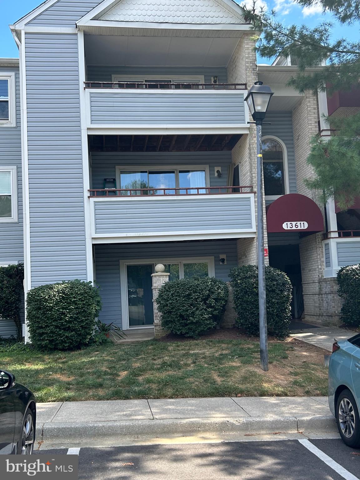 This lovely entry level condo is located in the quiet peaceful Vineyards Community. It has several natural green spaces surrounding with parks to stroll through for enjoyment. Each bedroom is spacious and the two bathrooms are generous. The Living room has a lovely fireplace to enjoy cozy evenings with a brick surrounded patio to enjoy cool summer breezes. The kitchen overlooks the family room with a serving bar and a dining area. Upgraded stainless steel refrigerator w/ice maker, stove, dishwasher, and built in microwave making entertaining comfortable. The Laundry room is off the kitchen with storage for mops and vacuums. There is an additional storage closet off the patio to store bikes or chairs. The building must be accessed by guest through a security door with an intercom system for safety. Enjoy the community center with a fitness center and outdoor pool. This ha easy access to county roads for commuting, shopping centers, and local restaurants.