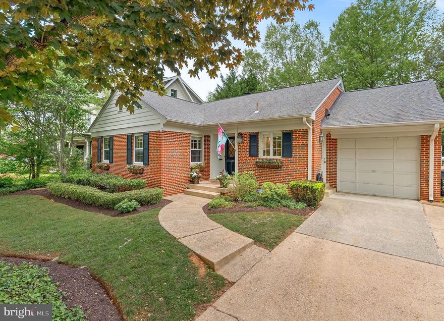 Location... location... location!   This beautifully built custom brick beauty is situated on a rare and expansive 12,281 sq. ft., (quarter plus acre) professionally landscaped, level lot! Located in popular Hillmead, in the Whitman school district which includes Bradley Hills ES and Pyle Middle, it is a short stroll from the front door to the park for a round of tennis, a game of basketball, a nature walk or creative play in the well equipped playground after a long day at work or school. Also walking distance to Suburban Hospital and you can be in downtown DC in minutes via a bus stop at Ridge Place and Greentree. Filled with brightness and cheer, this gem evokes the look and feel of an English country home and is perfectly perched to capture maximum sunlight throughout the day! You'll have room to roam both inside and out, with all sorts of delights to treat in between.  This home is in move-in condition with lots of amenities including; two fireplaces, gorgeous custom millwork, gleaming hardwood floors, remodeled kitchen, a large elegant living room with a wood burning fireplace, marble surround and a Mount Vernon mantle. The expansive lower level is completely fabulous and boasts a large recreation/family room with a masonry fireplace, a large home-office/flex space, two bedrooms or guest suites, a full bathroom and a convenient laundry room with an exit to the rear gardens.  A gorgeous sunroom is located off the dining room and this sundrenched space is perfect for sipping your morning brew as a light filled breakfast room, or a sitting room or playroom.   Just outside the sunroom, you can dine alfresco under the wisteria laden pergola.  Something is always blooming in the garden, and in the spring, you'll have layered perennials in the flower beds which proudly display an abundance of color. A treehouse at the rear of the yard is fun for wee people, teens, and tweens alike... adults are welcome as well... if they are up for the climb up the ladder!  The highly functional kitchen has a combination of open storage shelves plus cabinets and baskets for extra storage and a pantry. Gleaming quartz countertops complete the finishes in the kitchen which overlooks the front gardens and tree lined street.  The home boasts the remodeled kitchen, updated baths, a divine sunroom addition, gorgeous dining room with handsome mill-work and modern pendant lights as well as recessed lighting to capture that perfect mood.  This floor plan is very flexible and the home is in turnkey condition.  In addition, this home and location oozes opportunity for remodeling and expansion and a rare one car garage.  Do not miss the walk-up attic with tons of storage space and ready for your architect to draw all the possibilities!  This wonderful home and the opportunity to own it won't be available for long in this idyllic location. This home is filled with all of your favorite things and should not be missed!