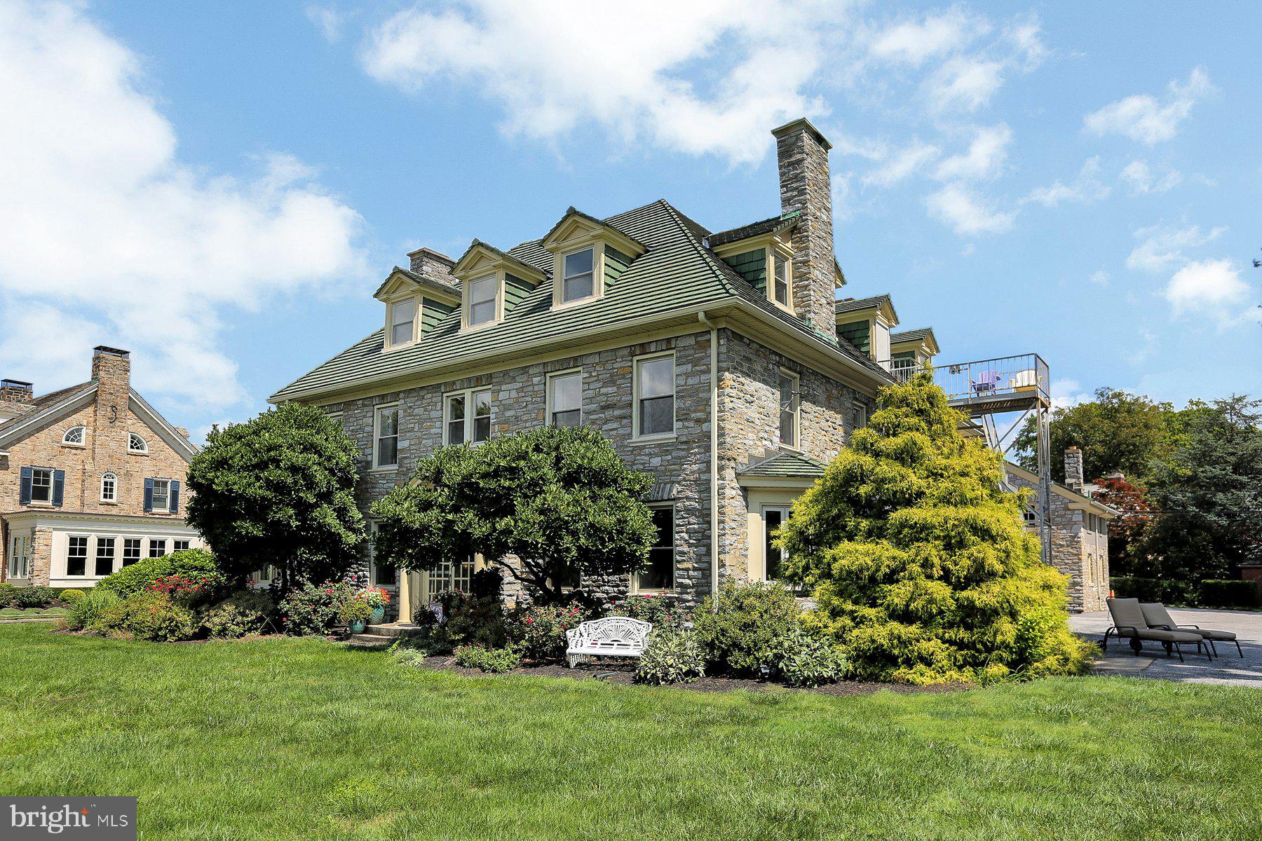 A rare opportunity to own an historic riverfront mansion in Harrisburg City! The Mary Sachs is a spectacular limestone mansion built in 1926 by a prominent Harrisburg businessman. This 8,000+ square foot estate sits above the flood plain along Harrisburg’s scenic river front. The property has been beautifully restored by the previous owners to preserve it’s character and charm while offering every modern amenity. There are numerous sitting areas with abundant natural light and the views…STUNNING!! On the first floor you will find 4 bedrooms, all with en-suite baths. An ‘Owner’s Suite’ or in-law quarters boasts a bedroom, full bath, kitchen and living room. On the second floor are two additional bedrooms with en-suite full baths, a large kitchen with granite countertops and stainless-steel appliances, dining room with a skylight and a huge living room with a fireplace and separate entrance. Every space is filled with natural light streaming and views that will dazzle. The third floor is a blank slate! A bathroom is roughed in, four possible bedrooms and common space…this could be additional living/workspace, or a revenue generating rental opportunity. Garage or ‘carriage house’ is ready for your personal touches; storage or parking on the first floor, but the second floor is another potential revenue producing possibility. A large studio space with a bathroom already roughed in, gas, electric and water utilities already installed.
The property is currently being run as a Bed and Breakfast, but the possibilities are endless! Fulfill your dream of being an Innkeeper! Or enjoy living in and entertaining friends at this historical gem on The Susquehanna yourself!