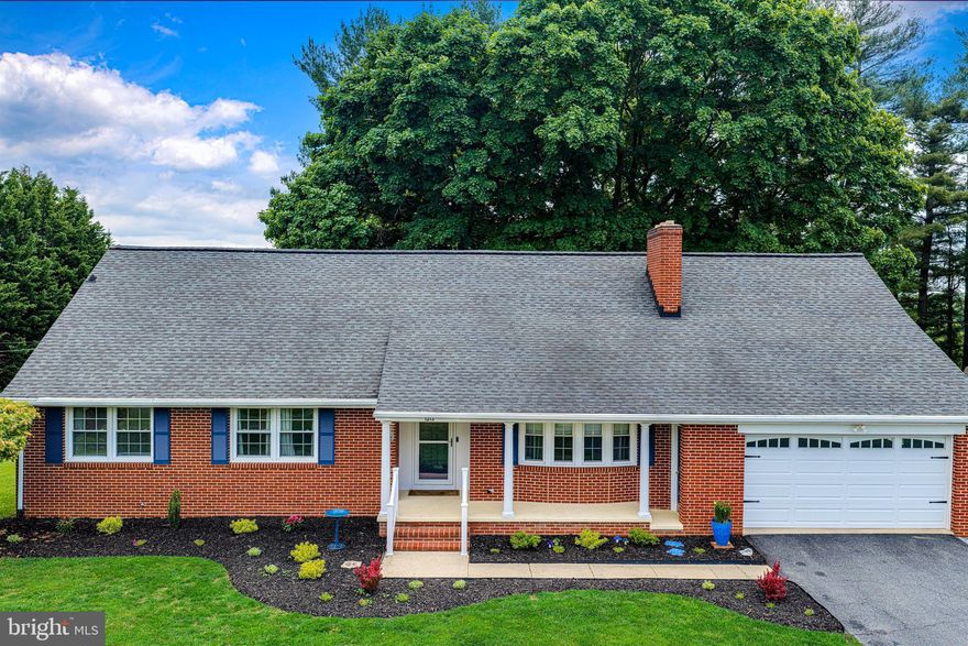 THIS CHARMING 4 BEDROOM, 3 BATH,  2,730 SQUARE FOOT, ALL BRICK CAPE COD BLENDS TIMELESS CHARACTER WITH MODERN UPGRADES, PERFECTLY SITUATED IN A VERSATILE VILLAGE RESIDENTIAL ZONE.  STEP INSIDE TO FIND GLEAMING HARDWOOD FLOORS AND A BRIGHT LIVING ROOM ANCHORED BY A LARGE BAY WINDOW AND A COZY STONE FIREPLACE. THE FORMAL DINING ROOM FEATURES ELEGANT CORNER CABINETS, BAY WINDOW AND DECORATIVE COLUMNS. THE FAMILY ROOM OFFERS AUTHENTIC KNOTTY PINE PANELING AND BUILT-IN SHELVING WITH AN ABUNDANCE OF WINDOWS PROVIDING NATURAL LIGHTING. 2023 REMODELED KITCHEN COMPLETE WITH STAINLESS STEEL APPLIANCES AND CUSTOM SOFT-CLOSE CABINETRY. ENJOY THE RARE CONVENIENCE OF TWO PRIMARY SUITES OFFERING AN IN-LAW POTENTIAL, ONE ON THE FIRST FLOOR AND ONE ON THE SECOND FLOOR EACH WITH A PRIVATE BATH. THE SECOND FLOOR BATH OFFERS A JUCUZZI SOAKING TUB WITH JETS. THE FULL HALL BATH WAS REMODELED IN 2024 FEATURING DOUBLE SINKS, A MODERN CERAMIC SHOWER AND STYLISH SIX-PANEL SLIDING CLOSET DOORS. THE SECOND FLOOR OFFERS A MASSIVE STORAGE AREA (28' X 22') ALONG WITH A WALK-IN CLOSET.  THE LOWER LEVEL OFFERS A SPACIOUS RECREATION ROOM (30' X 28') WITH NATURAL LIGHTING AND  DOUBLE DOORS LEADING TO  BACKYARD, LAUNDRY AND STORAGE ROOM.  WINDOWS ON FIRST FLOOR REPLACED 2021, BASEMENT WINDOWS 2023. THE EXTERIOR FEATURES A 1.25 ACRE LOT WITH COVERED FRONT PORCH, ATTACHED TWO CAR GARAGE,  AMPLE PARKING OFF DRIVEWAY FOR VR ZONING, RVS, CAMPERS, ETC. THE PRIVATE BACKYARD OFFERS A STUNNING LARGE TREE PROVIDING SHADE FOR THE LARGE CONCRETE PATIO FOR ENTERTAINING WITH EASY MAINTENANCE,  SHED 16' X 10' FOR STORAGE. NO HOA! THE ADVANTAGE OF THE SOLAR  PANELS AND BGE  SAVINGS ARE IN THE DOCUMENTS.