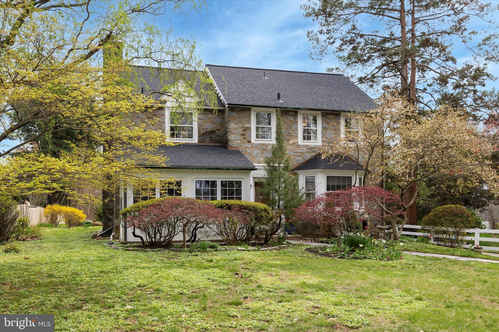Welcome to this beautifully updated & maintained 3-bedroom, 2.5-bath quintessential Main Line stone colonial nestled on a quiet, tree-lined street overlooking South Ardmore Park. Located within the award-winning Lower Merion School District in the high school choice zone, this classic residence offers a perfect blend of timeless charm and modern comfort with picturesque backyard & gardens.
A charming Stone facade and beautifully landscaped walkways welcomes you to this classic Main Line Home. Step inside to find a spacious and sun-filled layout with hardwood floors throughout, featuring a gracious living room with a stone fireplace, a formal dining room perfect for entertaining, and a sunny kitchen with breakfast room. The enclosed porch provides year-round versatility—ideal as a reading nook, cozy family space or home office.
Upstairs, you’ll find three generously sized bedrooms, including a spacious primary suite with a newly updated, light and bright en-suite bath with walk-in shower and ample closet space. The recently updated shared hall bath has marble tile floors, a pedestal sink, tub/shower combo and linen closet. From the hallway tucked behind a door, walk up the staircase to the attic which offers abundant storage. A full basement offers a partially finished family space, excellent storage, and laundry room along with a work bench as well as potential for future finishing. The attached 1-car garage and private driveway provide added convenience.
Outside, enjoy the beautifully landscaped garden, patio and yard, perfect for outdoor dining, gardening, or relaxing evenings with family and friends.
Set across from South Ardmore Park and all it has to offer with a new playground, tennis and walking trails. Close proximity to Suburban Square, shops, restaurants, markets and transit, this home is a rare gem in one of the Main Line’s most desirable neighborhoods.