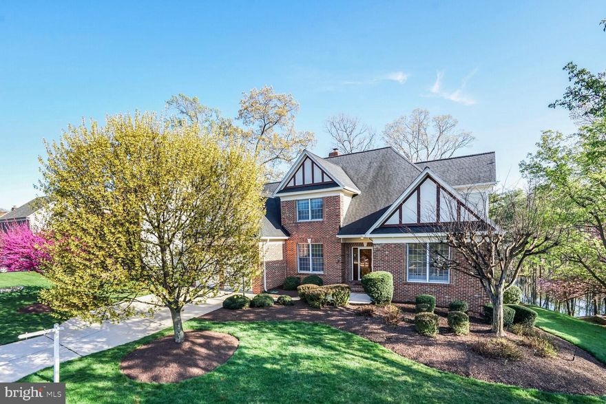 In sought-after  Woodland Lake situated on a quiet cul-de-sac with stunning water views, this beautiful home boasts over 4,900 square feet of living area with soaring ceilings, a main level en-suite primary bedroom, a huge fully finished lower level and scenic views throughout. The elegant foyer leads you to the spacious two-story living room with huge windows facing Woodland Lake and a two-sided gas fireplace. The large eat-in kitchen boasts stainless steel appliances including a double wall oven and gas cooking, a huge pantry, extensive cabinet space and a walkout to the expansive deck. In addition to the en-suite primary bedroom with two walk-in closets and a huge full bath, the main level also features a bright and spacious main level office/den, an elegant dining room, a half bath and an updated laundry room. The upper level has three large bedrooms all with new carpet, including one en-suite bedroom with a spacious walk-in closet. The huge, fully finished lower level boasts new carpet, a full bath, multiple storage rooms and a workroom complete with multiple work benches which could also serve as the perfect home gym or studio. The lower level also has a separate entrance leading to the natural oasis that is Woodland Lake and its encircling walking trail. Dual-zoned heating and cooling ensure comfort throughout, and the home has just been freshly painted from top to bottom. In the Fairfax County School District and less than three miles from the Franconia-Springfield Metro and VRE Station, this dearly loved home has been meticulously maintained by the original owner and is just waiting for you to make your own.