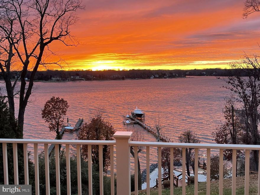 Rare opportunity for a true legacy property on the Severn River! Built by Pilli Custom Homes, this home is a masterpiece of craftsmanship. Wake up every morning to the everchanging scenery out your windows, step out onto your private balcony with a freshly brewed coffee from your in-room coffee bar, feeling the gentle river breeze as you watch sailboats drift by. Make your way down via the elevator or stairs to the heart of the home —a gourmet kitchen designed for both function and beauty. A commercial-grade stove, oversized island, high end appliances and butler’s pantry set the stage for memorable meals, whether it’s a casual breakfast in the sunlit dining area or a feast prepared for guests. The open floor plan ensures that no moment is spent away from the home’s most stunning feature—its endless panoramic water views. Mid-morning calls for a stroll, tram or ATV ride down to your private beach, toes in the sand, as the water laps gently at the shore. Perhaps it’s time for a boat ride. Your commercial-sized pier, equipped with multiple lifts and slips, makes it effortless to set out for an afternoon on the water. The land lovers can take an easy walk into Annapolis or stay closer to home and lounge by the heated saltwater pool, where the sound of the waves blends with the laughter of loved ones.  A distinguished home office showcases exquisite woodwork, built-ins, and a double-sided fireplace; a great place to catch up on some work if you can take your eyes off the mesmerizing views. As the day winds down, retreat to one of the many cozy sitting rooms including the stunning sitting room with walls of windows, a perfect hideaway overlooking the pool and river, ideal for a quiet moment with a book or a glass of wine. In the cooler months, the home's fireplaces—found in the living room, family room, office, and even the primary bath—offer warmth and ambiance. Evening entertainment takes shape in the lower-level London pub bar, where friends gather for a game of billiards or a lively conversation. A family movie night in the spacious den, a midnight swim under the stars. The possibilities are endless in a home designed for both grand entertaining and peaceful retreat. As night falls, retreat to the primary suite, a true sanctuary with a private balcony, a fireplace flickering in the background, and a spa-like bath where a deep soaking tub and towel-warming drawers create the perfect end to a perfect day. At 1900 Carrollton Road, every day feels like a dream—a life immersed in luxury, comfort, and the beauty of the Severn River. This is more than a home; it’s a legacy. Welcome Home!