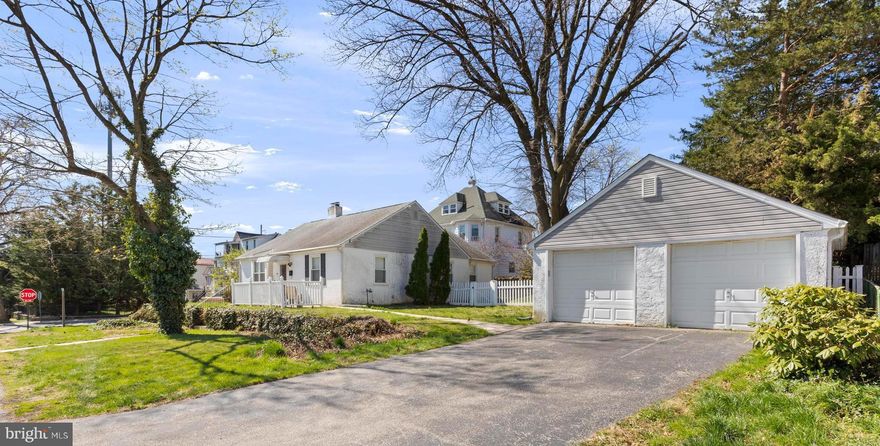 This charming sunlight filled rancher sits on a large corner lot in a quiet Secane neighborhood.  Entering the front door you will find a large living room with a stone fireplace and hardwood floors. Beyond is a dining room just off the galley kitchen. There are three good sized bedrooms along with a full bath with a stall shower and a soaking tub.   The basement is enormous and offers four large rooms for plenty of  storage.  There is a back deck that offers privacy and a great spot for enjoying a meal outside or a quiet place to read.  There is a shaded side yard and a large two car garage.  The public library is a short walk away and the location is convenient to shopping, restaurants, public transportation, and easy access to The Blue Route and 95.   Make an appointment to see this special home today.  Seller is a licensed PA Realtor