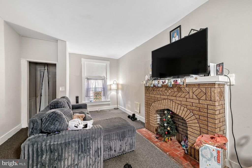 Photo of 818 N Curley Street, BALTIMORE, MD 21205 (MLS # MDBA2207024)