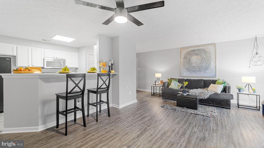 Welcome to chic condo living that effortlessly marries style and functionality. This 1193 square foot abode boasts 2 bedrooms, 2 bathrooms, and brand-new vinyl flooring from the front door thru the interior hallway, setting the stage for contemporary living. Upon entry, you'll immediately appreciate the spacious, sunlit living area, perfect for both entertaining and relaxation. The kitchen is ready to cater to your culinary desires. Two well-appointed bedrooms provide comfort and privacy. The primary bedroom, complete with an en-suite bathroom, offers a tranquil retreat. The second bedroom is versatile, adaptable to your lifestyle. Your private balcony beckons for morning coffee or evening serenity. Conveniently located near shopping and dining with easy access to 795 and the beltway. 

Don't miss this opportunity to make this 1193 sqft condo your own canvas for life's adventures. Schedule a showing today and discover the beauty and convenience of this exceptional property. Your dream lifestyle awaits!