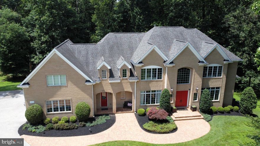THIS ABSOLUTELY STUNNING CUSTOM  BUILT ALL BRICK ESTATE WILL TAKE YOUR BREATH AWAY SERENELY SITUATED ON 5+ ACRES SURROUNDED BY DESIGNATED FOREST PRESERVATION LAND THIS PRIVATE RETREAT FEATURING NEARLY 9,000 SQ FT  CONVENIENTLY LOCATED IN CHARMING HIGHLAND GIVES YOU THE BEST OF BOTH WORLDS - THE ULTIMATE IN WOODED PRIVACY WITH ALL THE BENEFITS OF A NEIGHBORHOOD COMMUNITY  THE SOARING TWO STORY GRAND FOYER WELCOMES YOU TO AN OPEN FLOWING FLOOR PLAN IDEAL FOR GRACIOUS ENTERTAINING OR CASUALLY RELAXING WITH FAMILY AND FRIENDS  FEATURING 5+ BEDROOMS WITH A PRIMARY BEDROOM SUITE ON THE MAIN LEVEL 5.5 BATHS FULLY FINISHED WALK OUT BASEMENT WITH TREMENDOUS RECREATION ROOM AND EXPANSIVE OFFICE AREA  WITH SEPARATE PRIVATE ENTRANCE ALLOWS FOR FLEXIBLE USE EXPANSIVE FLAGSTONE PATIO WITH COVERED SITTING AREA OFF OF EXCEPTIONALLY WELL DESIGNED KITCHEN WITH GRANITE COUNTERTOPS THAT GO ON FOREVER HIGH END APPLIANCES & CENTER ISLAND PREP SINK 3 CAR GARAGE CUSTOM FIRE SPRINKLER SYSTEM AND SO MUCH MORE YOU DON'T WANT TO WAIT TO SEE IT SALE INCLUDES SEPARATE FOREST PRESERVATION PARCEL DESCRIBED AS DEANMAR DR  CONSISTING OF 3.43 ACRES (NON BUILDABLE) FOR A TOTAL OF 5+ ACRES TO CONVEY  SEE DOCUMENTS FOR LOT DESCRIPTION PLAT        Note:  Public Records  2007 Sale Amount of $500,000 was for land only, prior to construction
