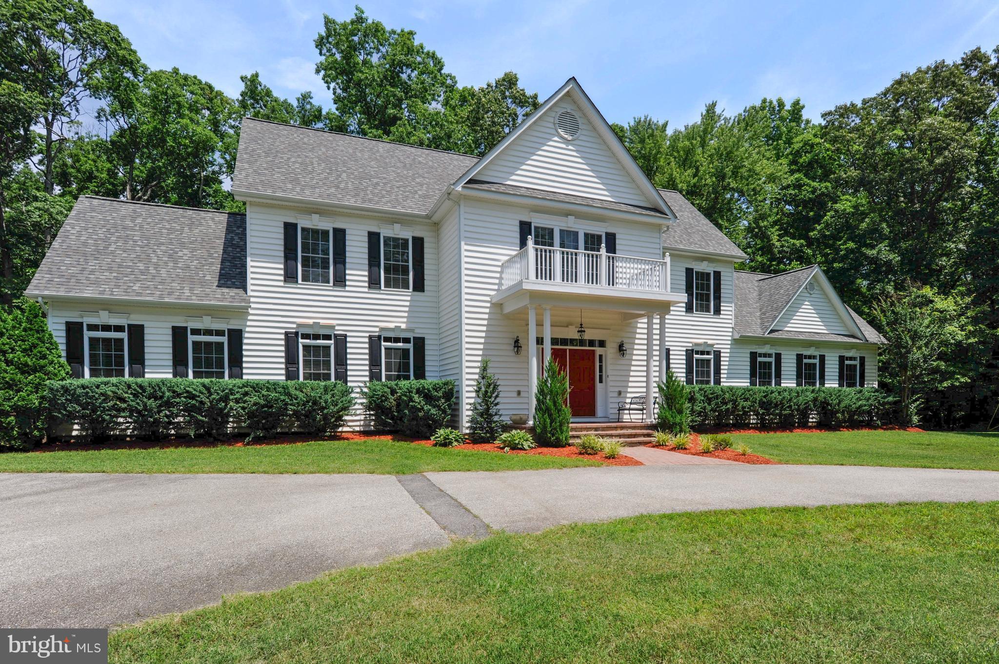 Custom, grand Colonial on 2 private wooded acres. This 5k+sqft beauty features 5bed/4.5baths, gourmet kitchen, an open floor plan, hardwoods, 10ft ceilings, lg family room, theater room, expansive master bed w/2walk-in closets, & large ensuite bath.Gourmet kitchen features custom cabinets, granite, ss app, wine cooler, wall oven & 5 burner range.New 50yr arch shingle roof & new septic system.