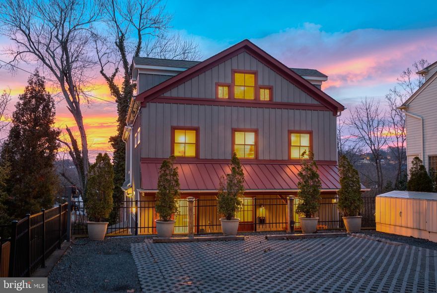 This rare and exceptional in-town residence offers sophisticated living in the heart of historic New Hope. Built in 2017, this 5 bedroom, 5 1/2 bath home seamlessly blends modern luxury, generous scale, and thoughtful design—an uncommon offering in such a coveted walk-to-town location. At the heart of the home is an extraordinary chef’s kitchen, perfectly suited for both everyday living and elevated entertaining. An expansive oversized island is complemented by a 48-inch Wolf range and hood, Sub-Zero refrigerator, handcrafted cabinetry, walk in panty, hardwood flooring, and a sunlit dining area. A separate Butler’s pantry adds exceptional function with additional prep and storage space, complete with its own refrigerator and wine refrigerator. The kitchen opens effortlessly to the family room, creating a warm and inviting central living space anchored by a striking stone fireplace. Additional highlights on the main level include a powder room, mudroom with dedicated dog bath, office, and workout room, —just a few of the thoughtful amenities throughout. The home offers five beautifully appointed bedrooms, including a private Owner’s Suite set on its own dedicated level for ultimate privacy and comfort. This luxurious retreat features Owner’s Bath, a large changing room/closet and a  large loft-style bedroom area. A standout feature of the home is the upper-level entertaining floor, designed as a refined party and lounge space for year-round enjoyment. This level showcases a dramatic two-sided fireplace that opens to both the interior gathering area and the rooftop deck, along with a full kitchen and full bath—creating a seamless indoor-outdoor experience ideal for entertaining. A discreet Murphy bed provides comfortable accommodations for overnight guests. Outdoor living is equally impressive. The fully fenced property offers privacy and versatility with multiple outdoor spaces including patios, welcoming front porch and outdoor hot tub —perfect for relaxing or hosting enhancing the home’s sense of retreat.  3 off-street parking spaces provide a level of convenience rarely found in town. Just steps from New Hope’s renowned shops, dining, and cultural attractions, 94 New Street presents a truly rare luxury opportunity.