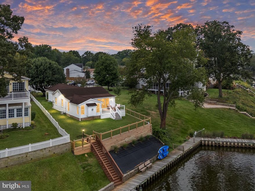 Stunning Waterfront Living on Middle River!
Experience breathtaking views inside and out with 73 feet of waterfront, complete with decking along the shoreline and a private pier featuring 6 ft MLW and an 8,000 lb boat lift. This fully remodeled home has been thoughtfully renovated throughout with timeless finishes and modern comforts.
The gourmet chef’s kitchen showcases quartzite countertops, white shaker cabinetry, a large island with seating, and top-of-the-line KitchenAid appliances including a gas cooktop, electric oven, wall oven, built-in microwave, and refrigerator. The kitchen flows seamlessly into the dining area, family room, and a sunroom with a cozy gas fireplace—all overlooking the water. Off of the sunroom, step onto a custom Trex deck with glass railings to enjoy unobstructed, stunning views of the river.
The primary suite boasts a fully renovated ensuite bath with dual sinks, walk-in shower, and custom walk-in closet with laundry. Two additional generously sized bedrooms share a beautifully updated full hall bath.
The finished lower level offers a versatile space perfect for a family room, office, or playroom, plus a convenient half bath.
Additional highlights include all-new light fixtures with recessed lighting throughout and pendant lights in the kitchen, new oversized gutters and downspouts, new siding, exterior lights, fenced backyard, and a newly installed retaining wall. A detached oversized garage with electricity provides parking for one car, a workshop area, storage above, and a driveway that accommodates up to four additional cars. Best of all—no flood insurance is required.
Perfectly located for easy access by car or boat, this home allows you to live like you’re on vacation every day. Don’t miss your opportunity to own this remarkable waterfront retreat!