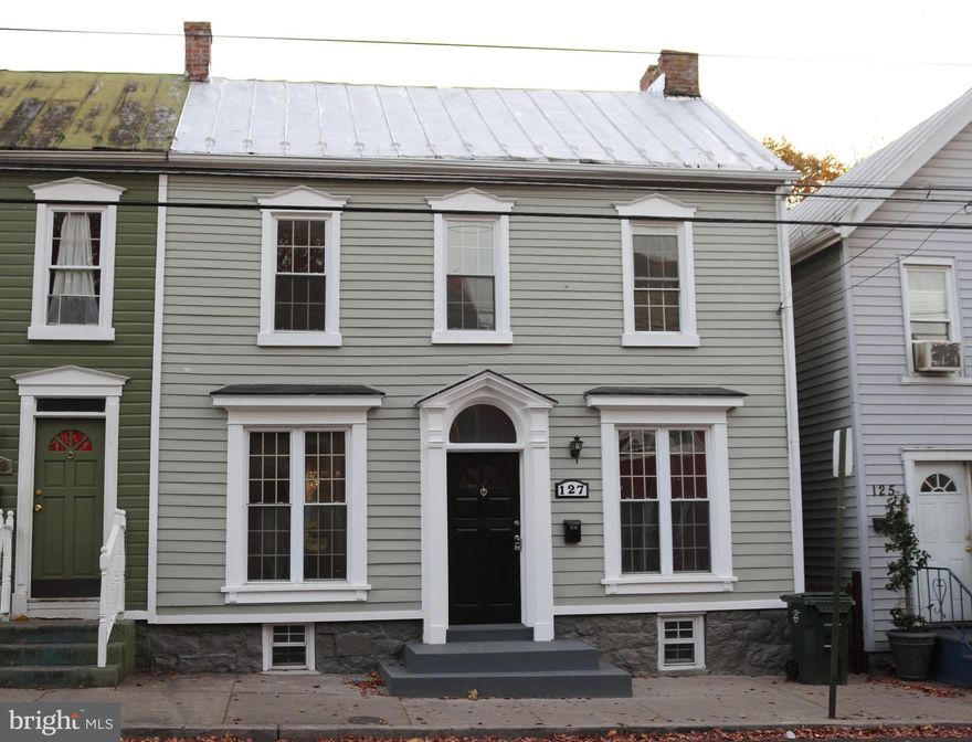 Nicely remodeled single-family home that shows well!  Recent updates include updated kitchen and baths, fresh paint and new carpets.  Main level offers kitchen, dining room, living room, full bath and a bedroom. Upper level offers two bedrooms, a full bath and two landing areas, one with access to back porch overlooking nice back yard.  Also, walk-up attic has been finished.  Easy to show!