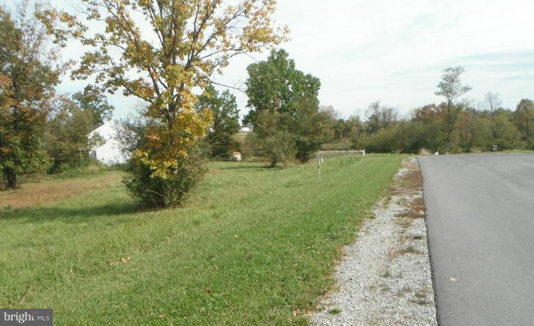 Level, centrally located, finished building lot! .2 Acres! Come and build your brand new home close to schools, shopping, the hospital and more! Close to the interstate for commuters!