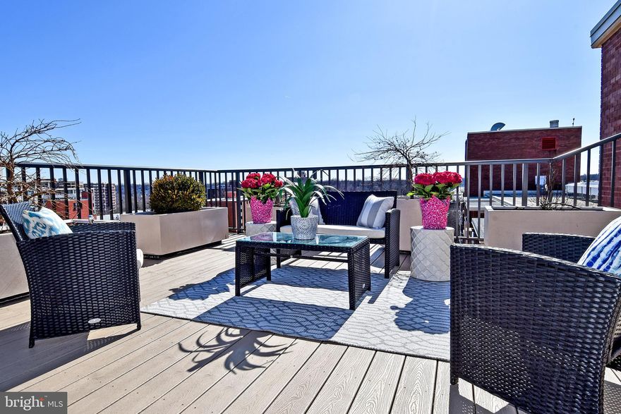 Experience singe family living in this light-drenched and airy condo showcasing a thoughtful living space which has been tastefully remodeled. Enjoy expansive views and year-round entertaining when the time is right on the HUGE Private Rooftop Terrace with a glimpse of the White House! Enter your formal foyer with hardwood flooring, a large coat closet and powder room from your private entry and key-accessed elevator. Space and light are in high volume with expansive living areas, the family room off the kitchen includes custom-designed bookshelves and large floor to ceiling windows, and the large living room includes a fireplace with plantation shutters. Relax in front of the fireplace as you rest after a long day. This ideal open floor plan features a designer-done inspiring modern kitchen with top-of-the-line stainless steel appliances, granite counters, under cabinet lighting, large pantry and generous eat-in area.  A spacious 5-star hotel master suite with floor-to-ceiling sliding doors leads to the huge private terrace. Custom designed spa-style bath with custom granite vanity and custom-built closets perfect the stylish master wing.   The second bedroom is complete with floor to ceiling windows and easy access to the updated luxurious hall bath with a large shower and tastefully done tiling. The excellent light-filled space for an office or den with custom bookshelves and the perfect place for your laptop has easy access to the huge 700+sqft terrace and star gazing. A stunning array of designer finishes includes gorgeous hardwood flooring, recessed lighting, granite countertops, oversized windows to gather sunlight, 9-1/2 foot ceilings, wainscoting, crown molding, in-unit laundry, elevator keyed access to private entry, two garage parking spaces, and much more. An array of resort-like amenities are offered including an outdoor pool, sun deck, 24-hour concierge,  tennis courts, barbeque areas and much more.   Utilities are included in the condo fee! A centralized location with easy access to 395 and GW Parkway, highly walkable, and just minutes to Downtown D.C. with all nearby shops and restaurants.  Amazon HQ2 and Whole Foods have joined this neighborhood too! Enjoy an indoor/outdoor lifestyle and stress-free living in this highly sought-after 2 bedroom plus den penthouse condo in National Landing.