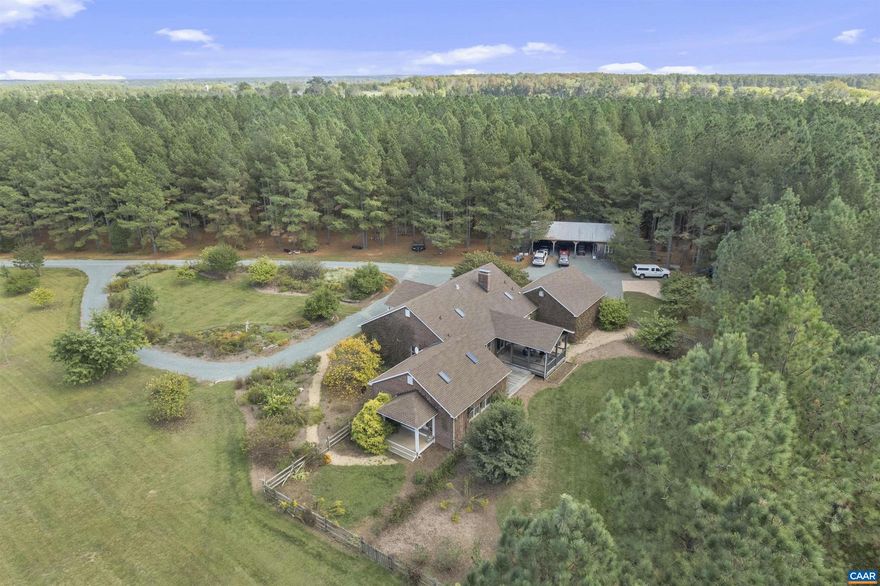 Welcome to REDBUD FARM, a 54-acre sanctuary in the GREEN SPRINGS HISTORIC DISTRICT. Pass through the gates and down a quarter-mile drive of blooming Redbuds to a residence designed for effortless one-level living. This 3,000 sq. ft. home features an expansive living room with a masonry fireplace and custom built-ins. The kitchen is a gourmet blank canvas with a fireplace, while the primary suite offers a private retreat with skylights and a whirlpool tub.  The grounds are a rare find: 50 acres are secured by premium woven-wire fencing, ideal for equestrian or livestock use. Quality infrastructure includes a 24? x 48? pole barn with a workshop and three equipment bays, plus a solar panel array to offset energy costs. For recreation, enjoy the tranquil 1-acre pond with a private dock and fountains, or explore trails through future groves of Oak and Maple. Bordered by mature pines and the historic 884-acre Burnley Farm?preserved in conservation easements?your privacy and views are guaranteed for generations to come.,Formica Counter,Oak Cabinets,Fireplace in Family Room,Fireplace in Kitchen,Fireplace in Living Room