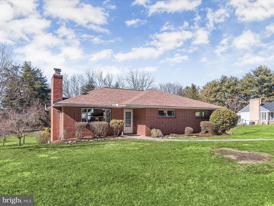 OFFER DEADLINE Monday 2/19 at 8am. Welcome to your new home in Ellicott City! This all-brick rancher exudes timeless charm and offers an exceptional blend of indoor and outdoor living.  As you approach, a lush green front lawn is complemented by a curved slate walk and a covered porch.  Convenience meets functionality with a private drive leading to the rear garage and an additional parking pad. The expansive tree-lined rear lawn sets the stage for extraordinary outdoor gatherings, complete with a fire pit for cozy evenings under the stars. Step inside to discover perfected main level living, featuring three bedrooms adorned with rich hardwood floors throughout. The fully upgraded kitchen, renovated in 2020, boasts stainless steel appliances, quartz countertops, subway tile backsplash, and luxury vinyl plank flooring, creating a sleek and modern culinary space. Unwind in the inviting living room, where a cozy wood-burning fireplace with a stone surround beckons on chilly nights, while a picture window floods the room with natural light. Adjacent, the formal dining room offers hardwood floors and another picturesque window, ideal for hosting intimate dinners or casual family meals. The main level also showcases an upgraded owner's suite bathroom, featuring designer tile and fixtures for a touch of luxury. Downstairs, a fully finished lower level with luxury vinyl plank flooring and painted paneling set the stage for versatile living spaces. Bright and airy, the open-plan layout encompasses a recreation room, game area, and a potential for a designated work-from-home space, ensuring ample room for relaxation and productivity alike. An upgraded walk-out door with integral blinds provides exceptional light indoors, while seamlessly connecting indoor and outdoor living.  Easy access conveniently unfolds to outdoor living including the patio, tree lined lawn, picnic table and fire pit.  The rear entry garage offers interior access and includes a generous 12 x 12 storage area, providing plenty of room for your belongings and hobbies. Additional improvements include an architectural roof installed in April 2019 and a new AC unit installed in July 2020, offering peace of mind for years to come.  Don't miss the opportunity to make this Ellicott City gem your own and experience the comfort, style, and convenience in Howard County Maryland!