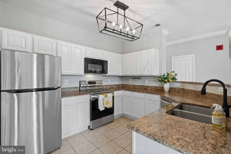 Rarely-available 3 bedroom, 2 full bathroom "Christine" model at the always popular Gates of McLean community is move-in ready with fresh Sherwin-Williams paint throughout and new SS appliances! New plumbing fixtures and light fixtures! Open floorplan seamlessly blends the kitchen with combination living & dining rooms for perfect daily living & entertaining space. Direct access to balcony from the dining room. Nicely-upgraded kitchen with granite countertops, SS appliances and just-painted 30" cabinetry for a light & bright look. Convenient laundry closet just off the kitchen. Private primary suite provides walk-in closet and tiled tub-in-shower. Two additional bedrooms along with hall full bathroom with double sinks and second tiled tub-in-shower. Newer windows & hot water heater. Two assigned outdoor parking spaces. Extensive community amenities include: clubhouse; fitness center; party room; media room; business center; outdoor swimming pool; tot lot & basketball court! Condo fee includes water. Fantastic location with quick access to Rt123 and the Beltway. Walking distance to Wegmans, McLean Metro station on the Silver Line, and the vibrant Capitol One Center with restaurants, shops, community events and Performance Hall with amazing live shows! Schedule a showing today!