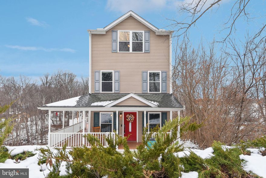 Welcome to 14844 Toll Road in New Windsor, MD. A spacious 3-bedroom, 2.5-bath country home set on 3 acres in a peaceful countryside setting, offering classic charm and a rare blend of comfortable interior living with a beautifully wooded landscape and creek views woven into the rear of the property.

A true wrap-around covered porch extends across the front and along the side, creating a warm first impression and an inviting extension of the living space. With room for rocking chairs or outdoor dining, it captures the everyday enjoyment people imagine when they picture country living.

Inside, the main level features rich Brazilian hardwood flooring and an easy flow designed for daily life and gatherings. The kitchen offers granite countertops, custom maple cabinetry, stainless steel appliances, and a generously sized island with seating — a natural gathering space at the heart of the home. The living room is open and airy, highlighted by vaulted ceilings and French doors that bring the surrounding landscape into view.

On the first upper level, two well-sized bedrooms share a full hall bath, with laundry conveniently nearby.

Privately positioned above it all, the top level is devoted entirely to the primary suite. Vaulted ceilings add dimension, while a walk-in closet and attached bath with marble flooring, double vanity, separate shower, and soaking tub provide comfort and function.

Outdoors is where the setting lingers. The wrap-around porch overlooks a backyard where wooded acreage and a gently winding creek add quiet depth to the landscape.

Located in Carroll County, New Windsor offers rural charm with convenient access to Westminster, Mount Airy, and major commuter routes connecting to Baltimore, Frederick, and beyond.